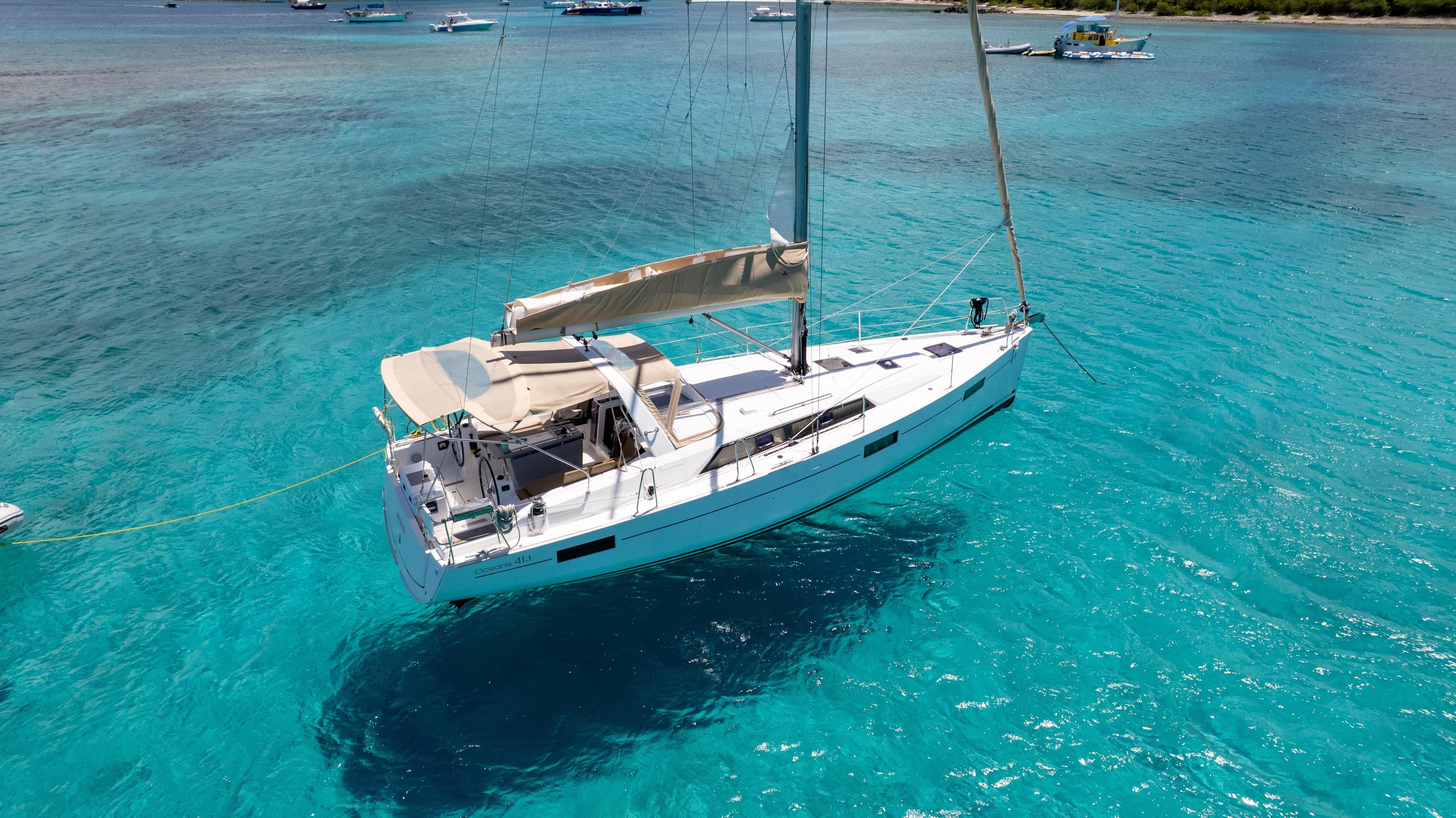 2018 Beneteau Oceanis 41.1 sailboat anchored in clear turquoise waters.