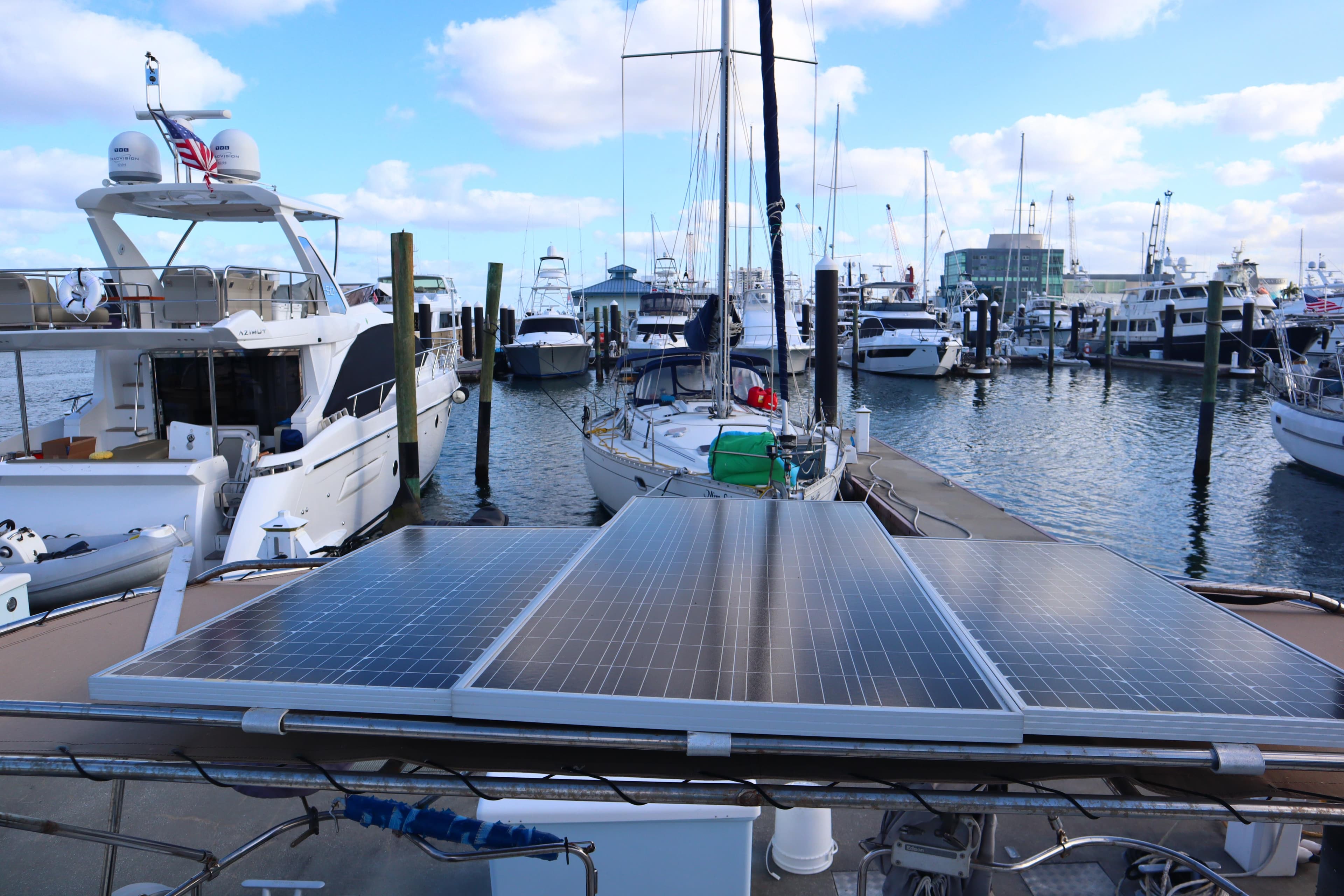 Sailboat with solar panels docked in marina, Hunter 37 model, 1997.