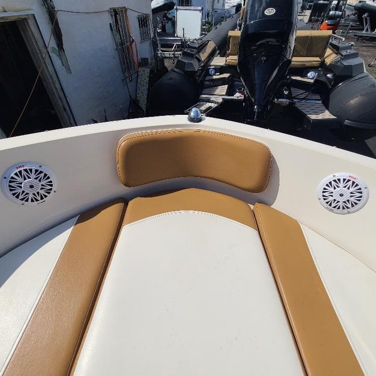 2019 Bayliner VR5 Bowrider OB interior with tan seating and speakers.