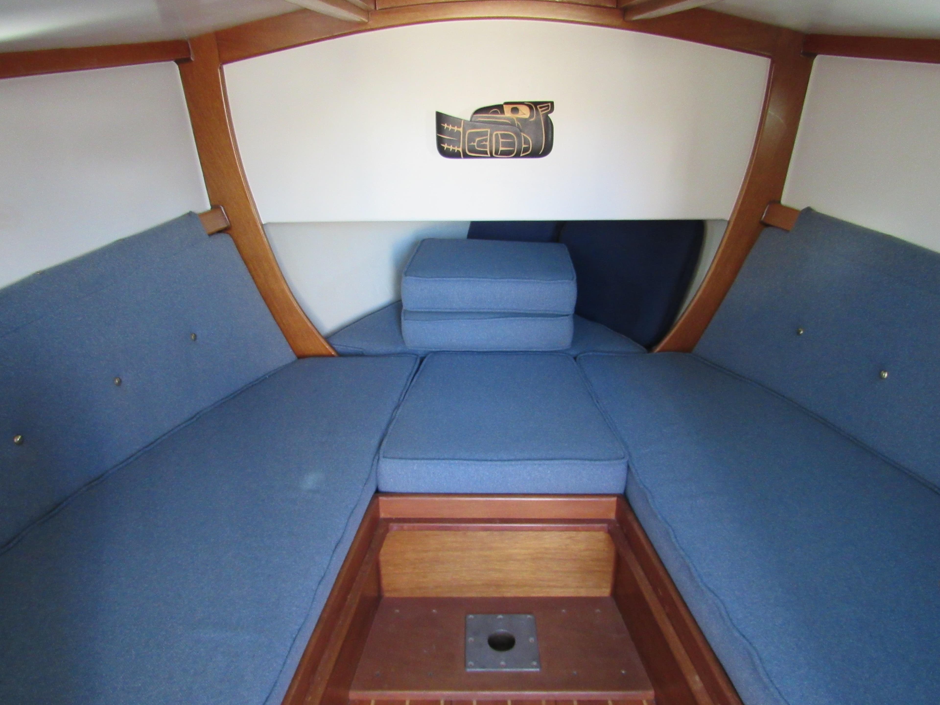 Interior of 1992 Devlin Surf Scoter boat with blue cushioned seating.