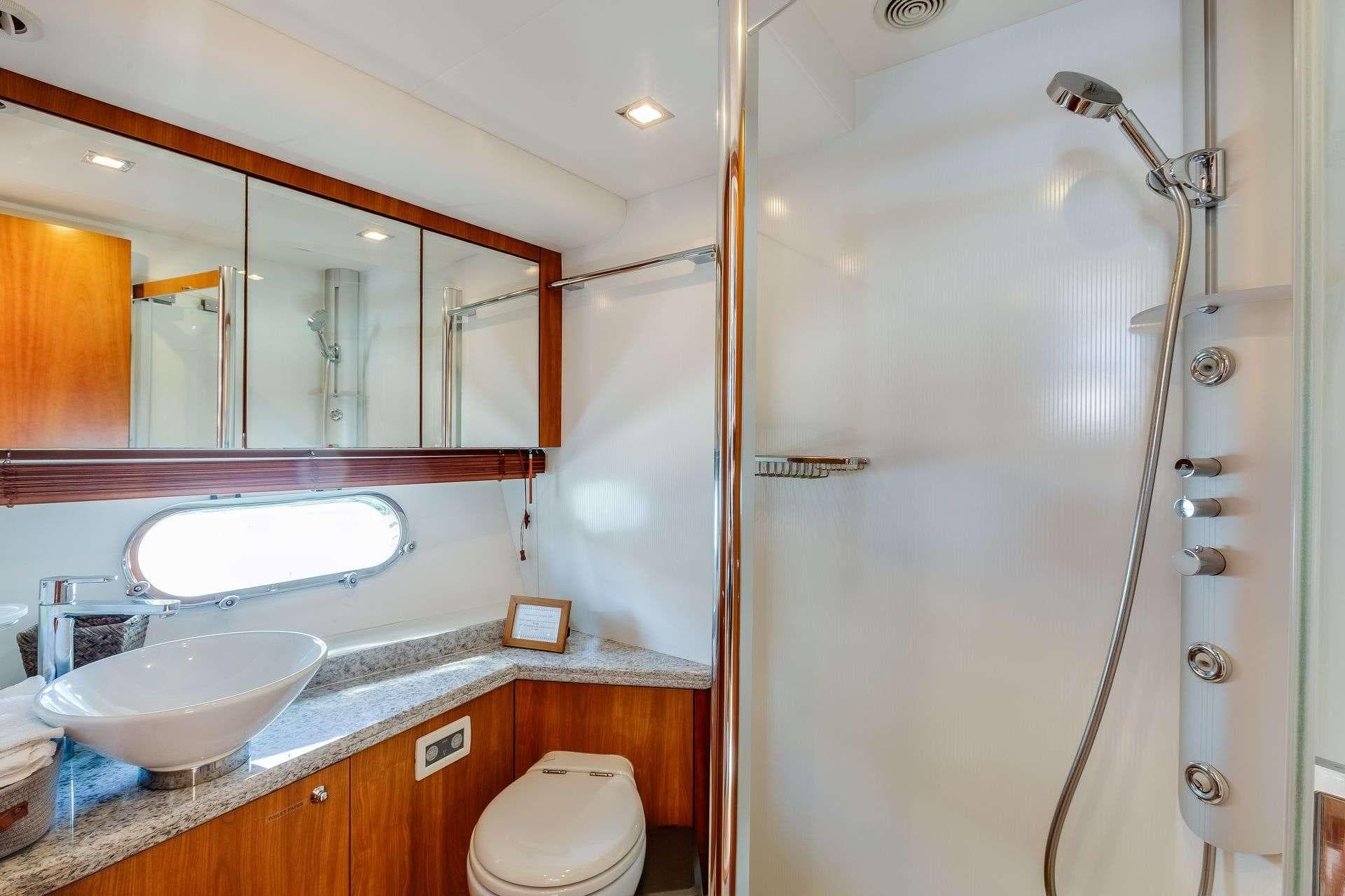 Luxurious bathroom in 2009 Sunseeker Manhattan 70 yacht with modern fixtures and elegant design.