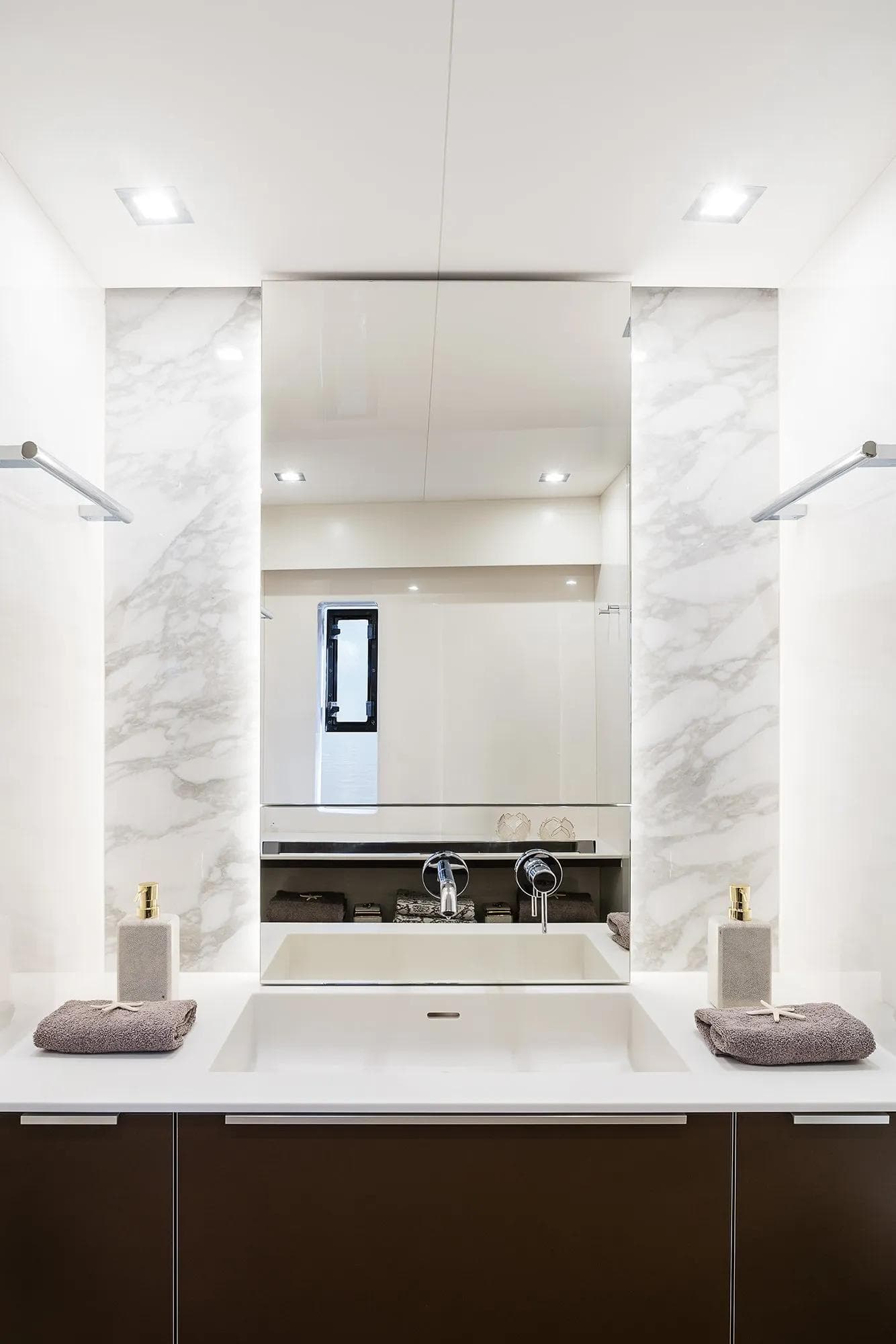 Luxurious bathroom interior of 2026 Sunreef 50 yacht with modern fixtures and elegant design.