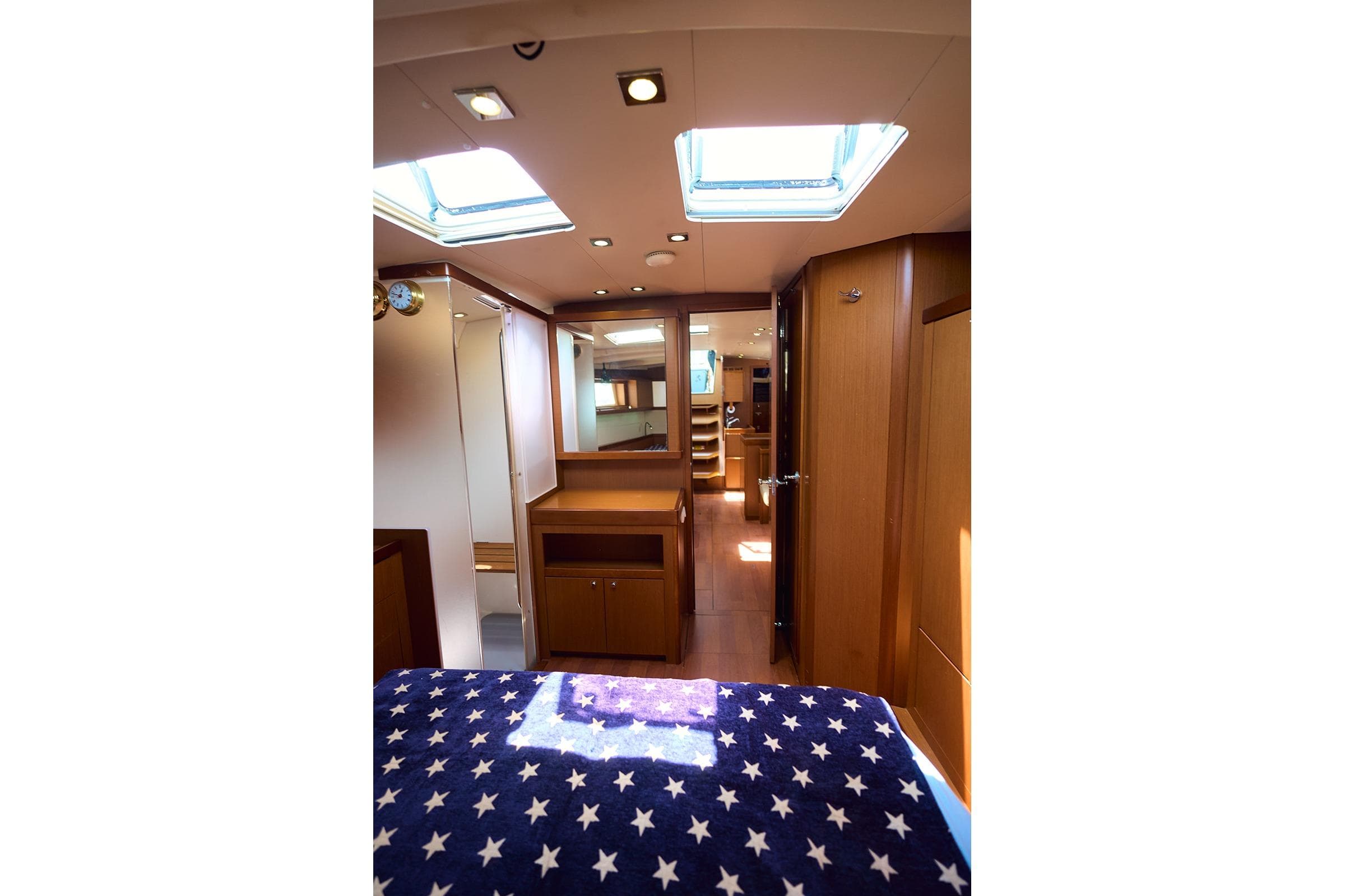 Interior of 2014 Beneteau Oceanis 48 yacht, featuring skylights and wooden cabinetry.