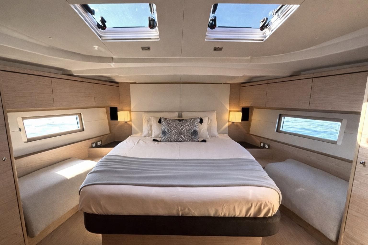 Luxurious cabin interior of 2019 Beneteau Oceanis 51.1 yacht with skylights and modern design.