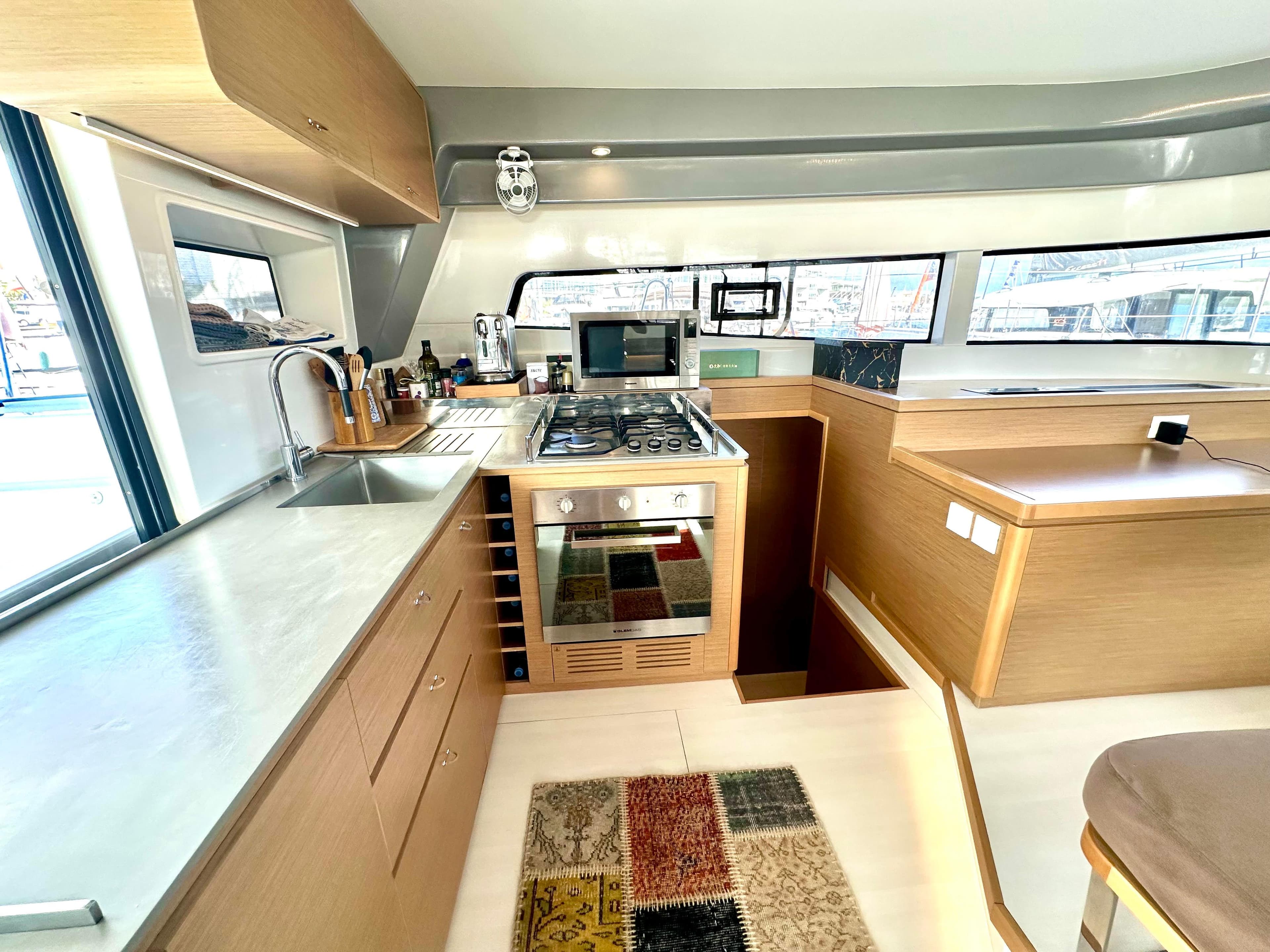 Modern kitchen interior of 2023 Excess 15 yacht with sleek design and appliances.