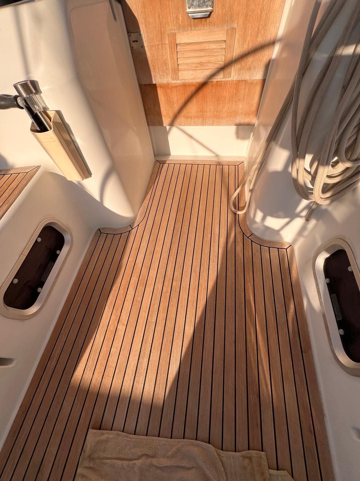 2007 Grand Soleil 43 yacht deck with teak flooring and nautical equipment.