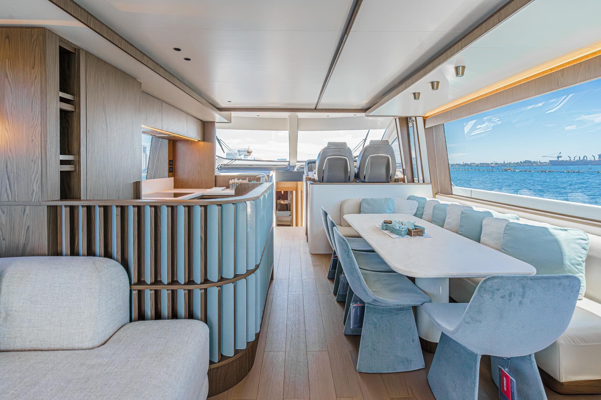 Luxurious interior of 2026 Azimut Fly 72 yacht with elegant dining area and ocean view.