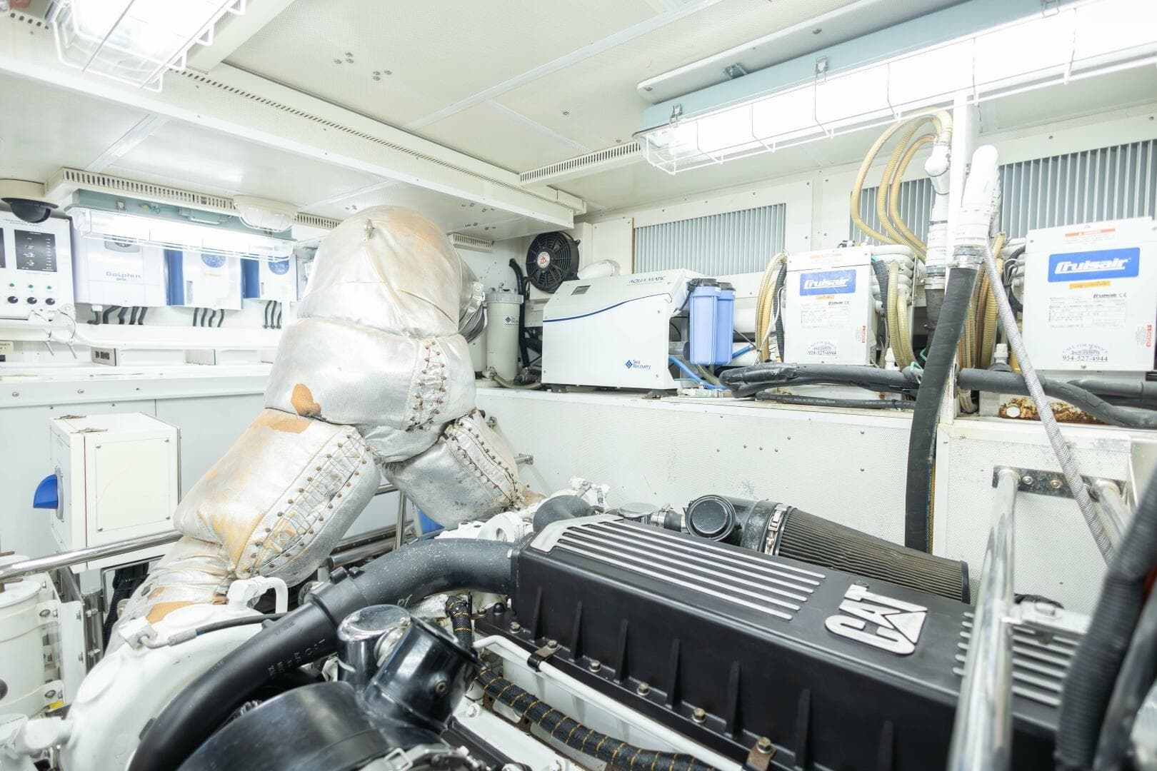 Engine room of 2009 Hargrave Enclosed Bridge yacht, featuring CAT machinery and equipment.