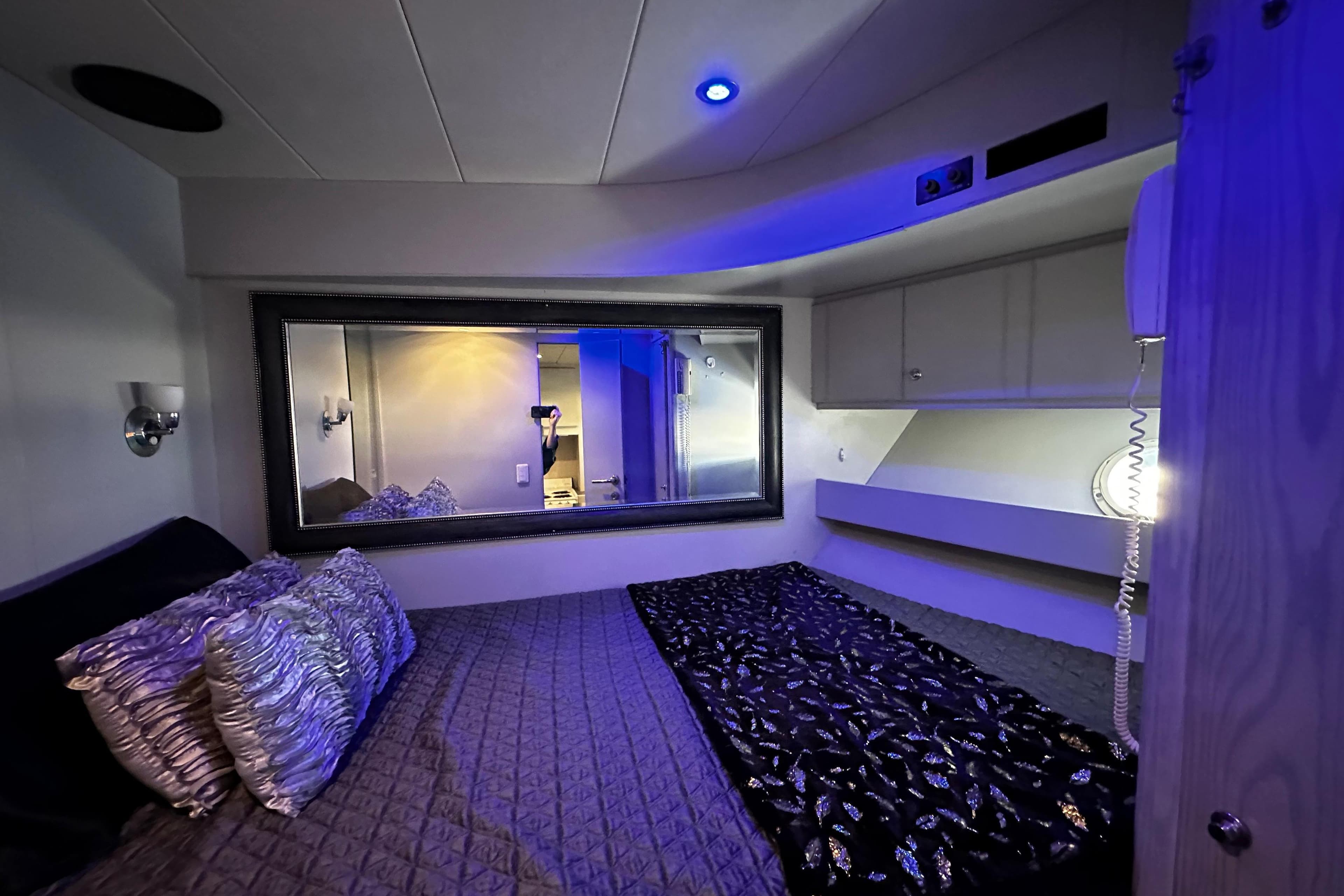 Luxurious bedroom interior of 1996 Monte Fino 92 yacht with elegant lighting and decor.