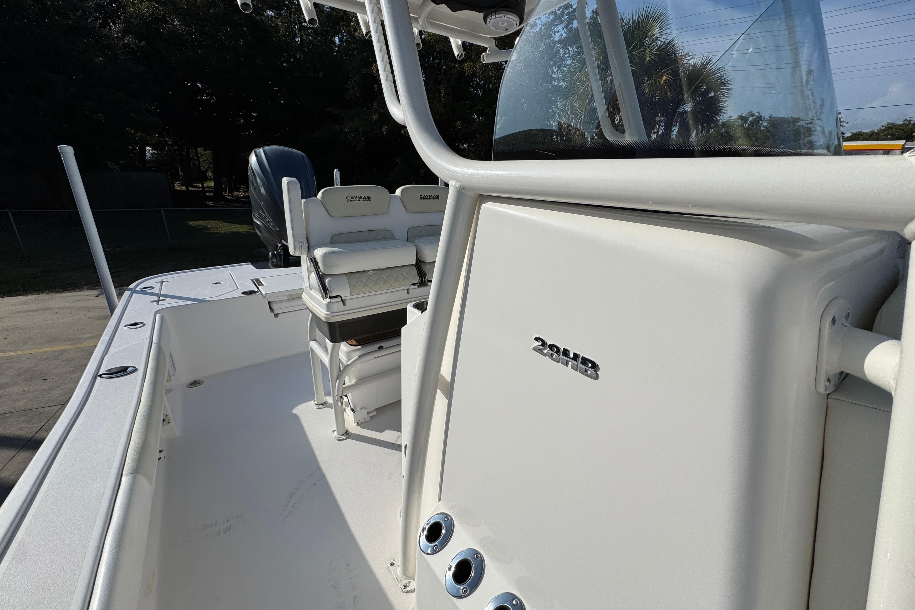 2020 Caymas 28 HB boat interior with seating and console, showcasing sleek design.