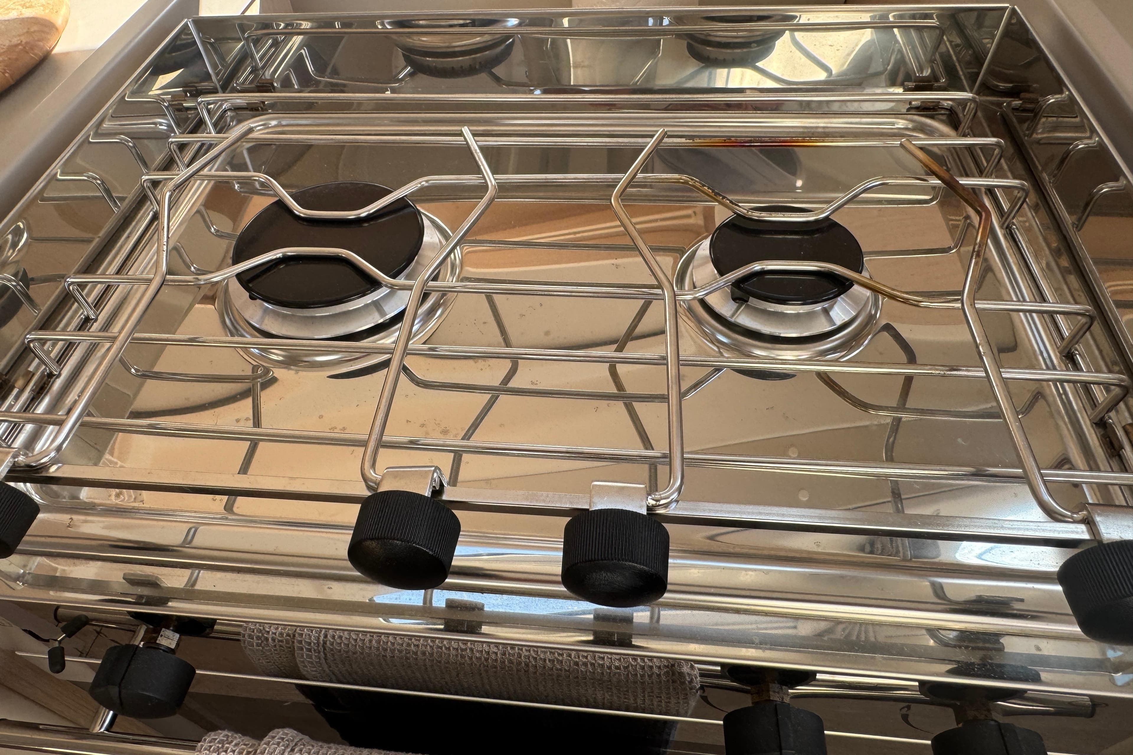 Stainless steel stove on 2023 Beneteau Oceanis 38.1 yacht, featuring dual burners.