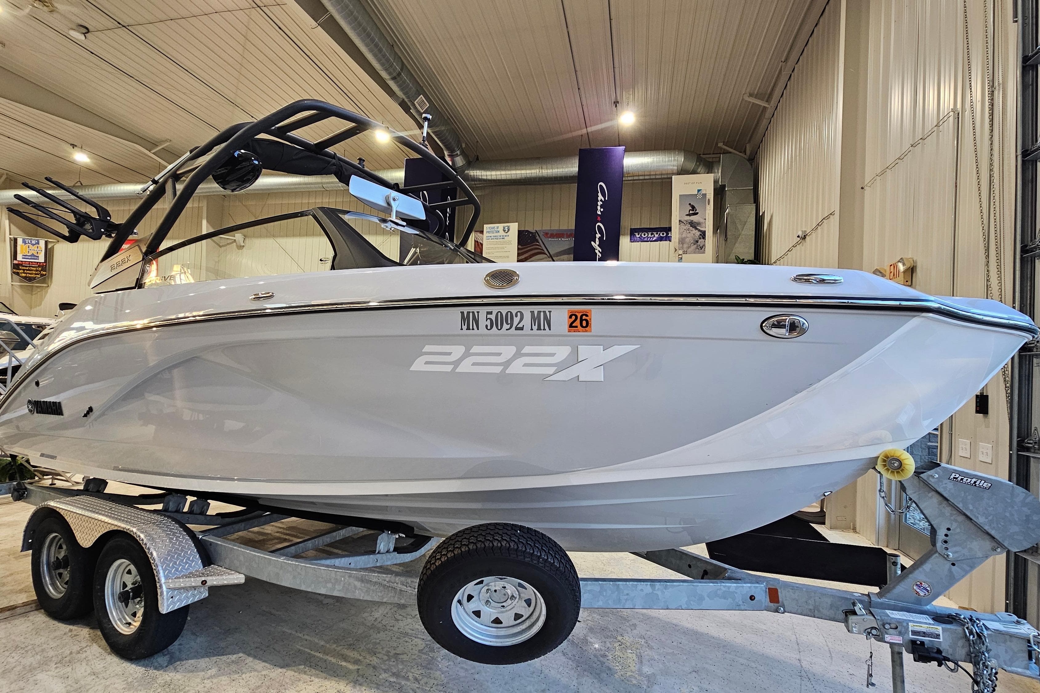 2023 Yamaha Boats 222XD on trailer in indoor showroom setting.