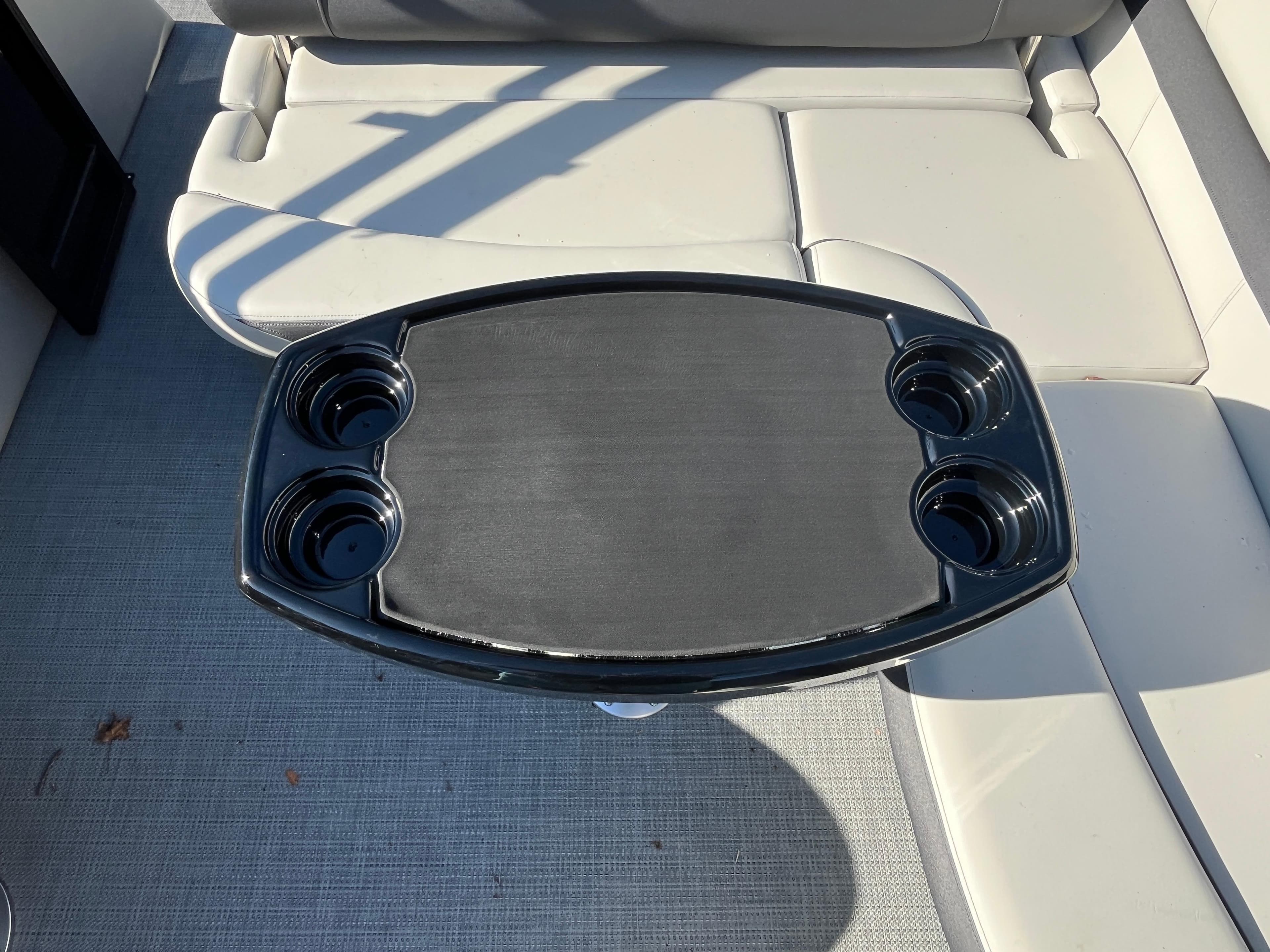 Starcraft EXS-3 2025 boat interior with cup holders and seating.