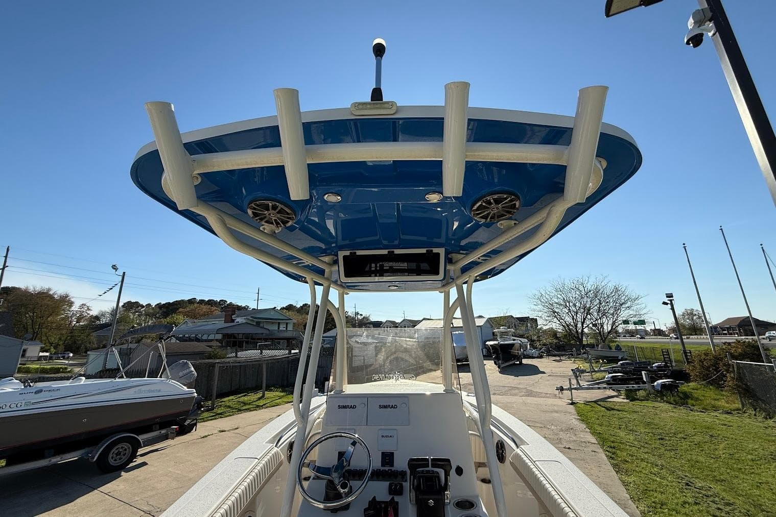 2019 Sea Chaser 24 HFC boat with blue T-top and steering console.