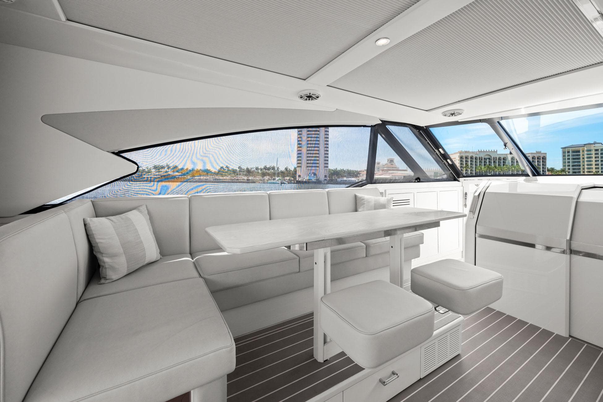 Luxurious interior of 2025 Formula 500 Super Sport Crossover yacht with elegant seating and table.