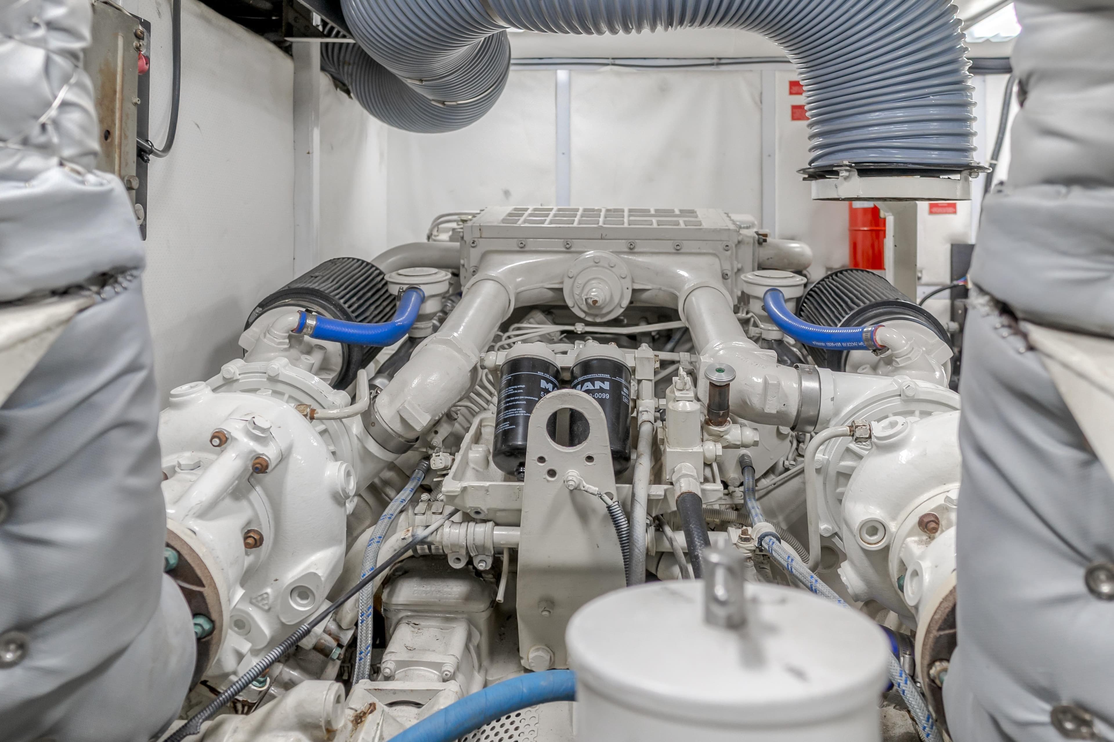 Engine room of a 1997 Viking Sport Cruisers 66 Motor Yacht, showcasing mechanical components.