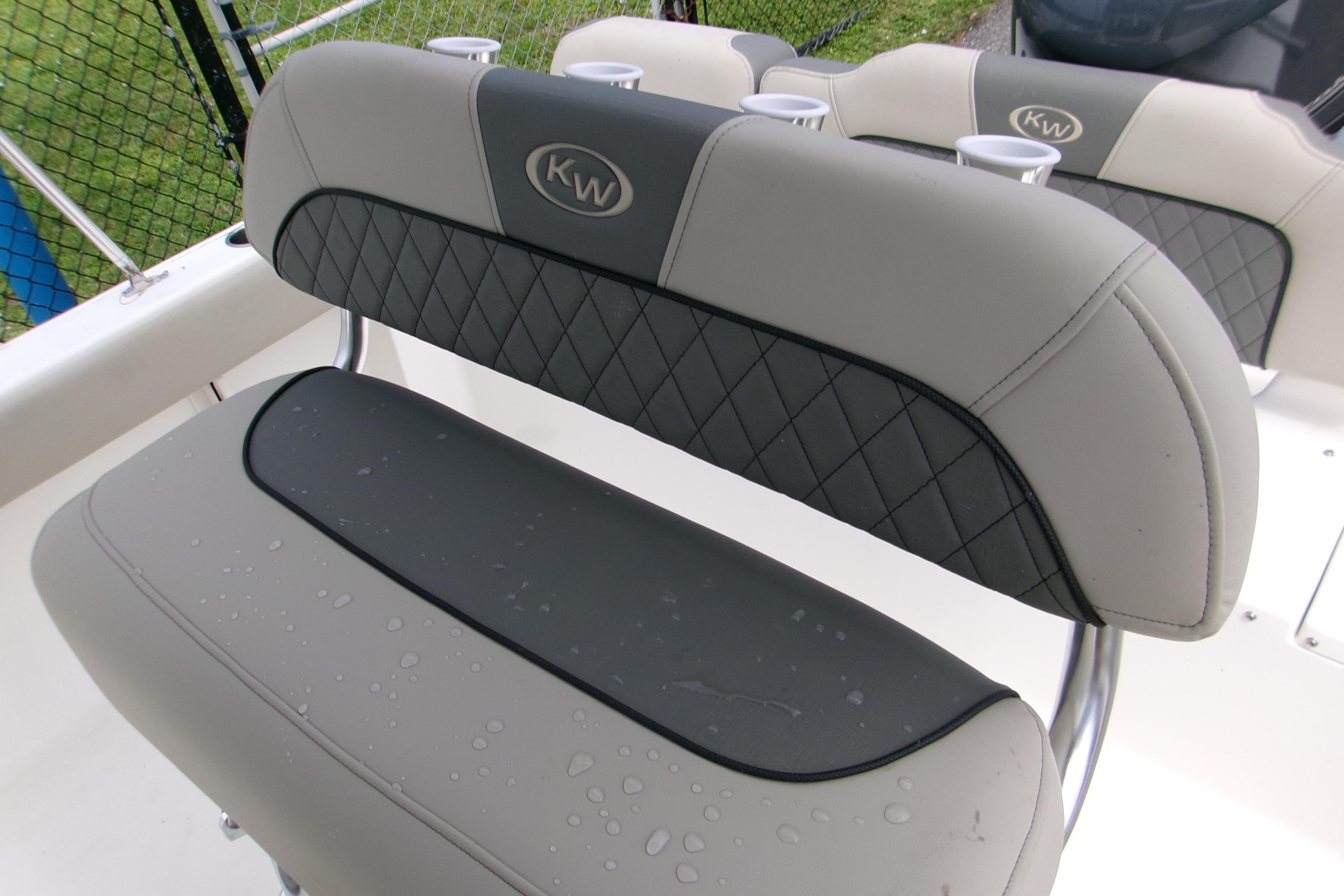 2026 Key West 189 FS boat seat with cup holders, featuring diamond-patterned upholstery.