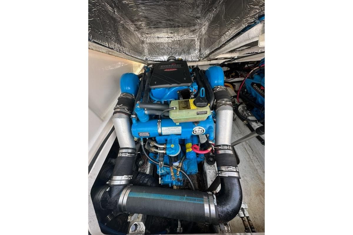 Engine compartment of a 2006 Tiara Yachts 2900 Coronet, featuring a blue marine engine.