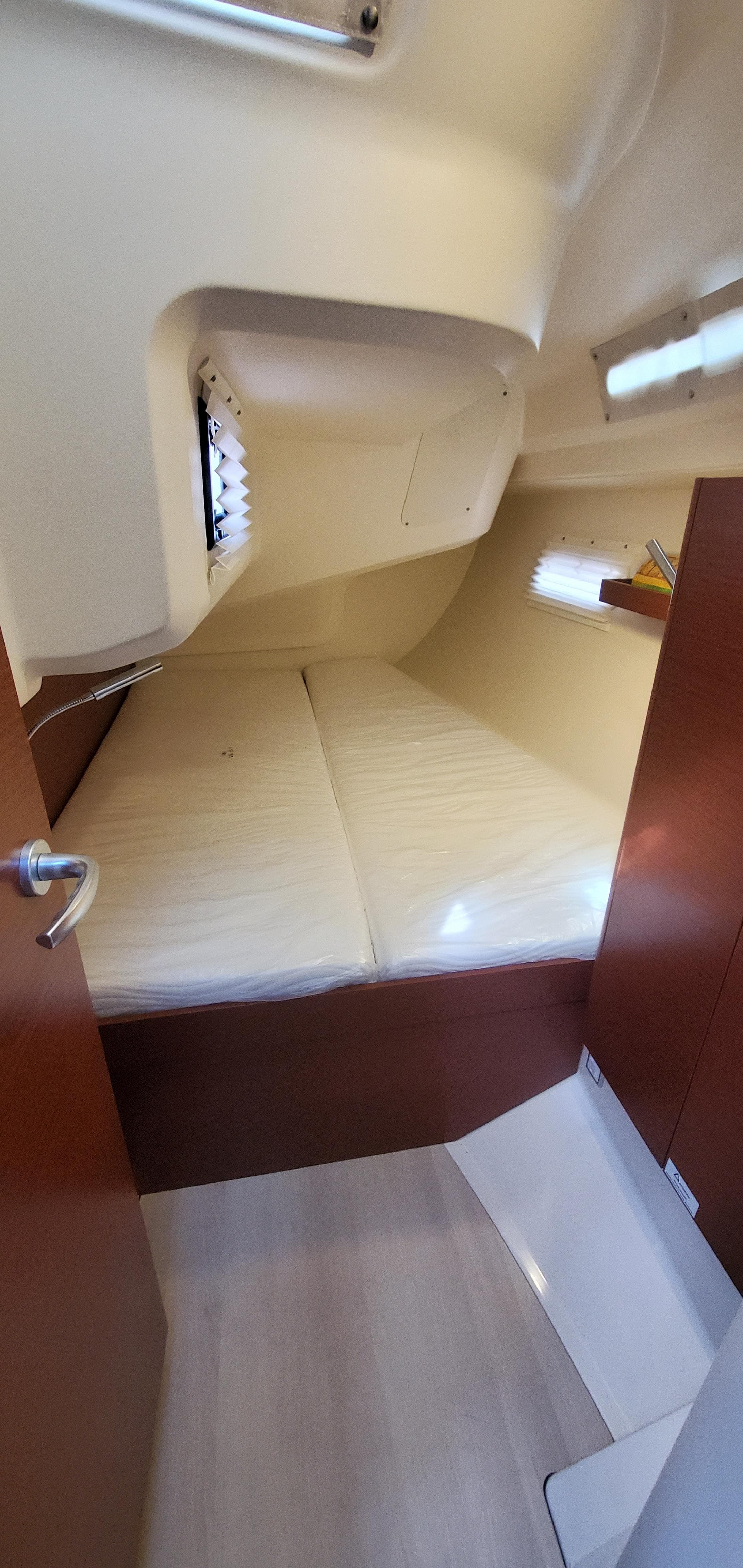 2024 Hanse 388 yacht interior cabin with cozy sleeping area.