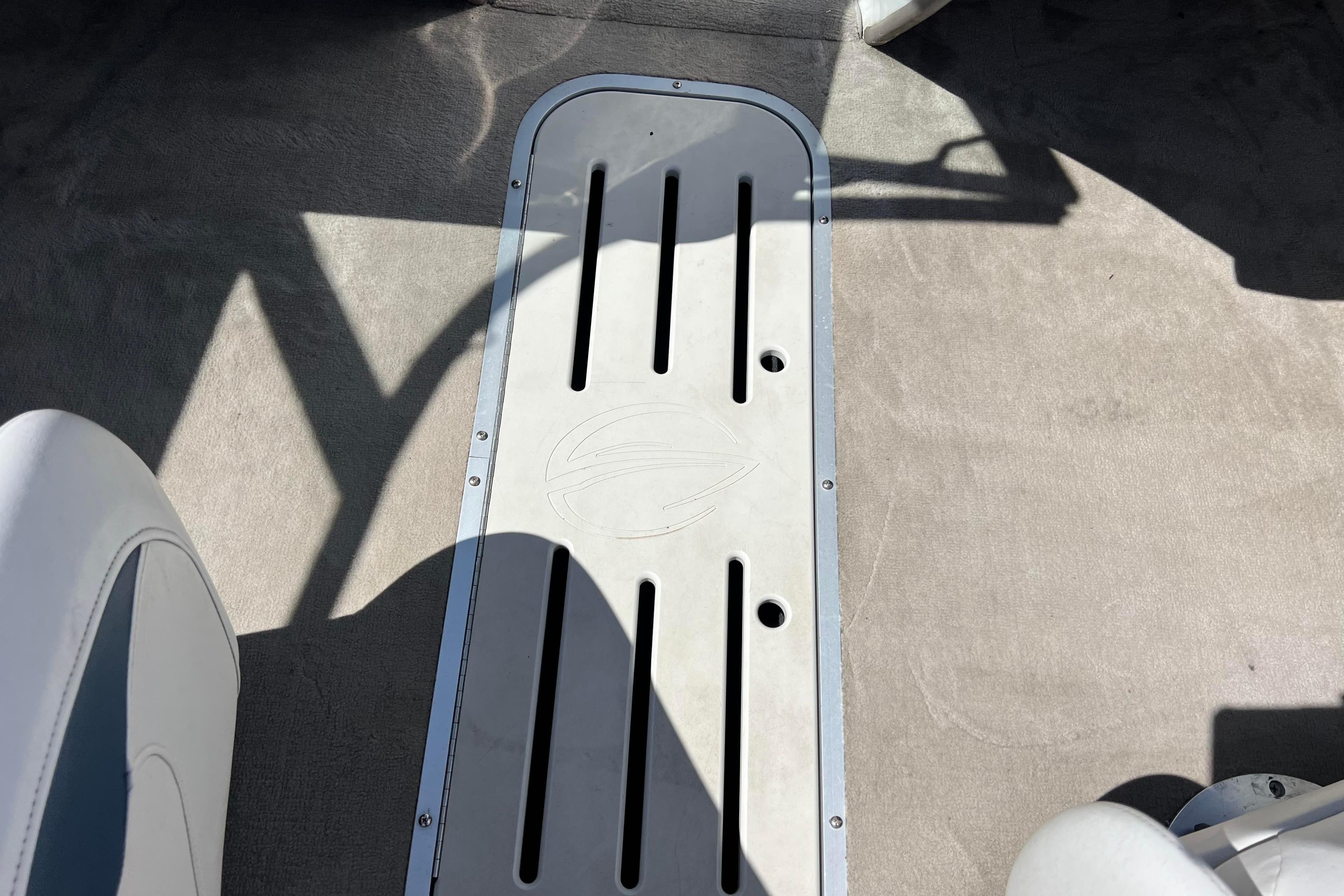 Interior of a 2007 Crownline 180 BR boat, featuring a sleek floor panel design.