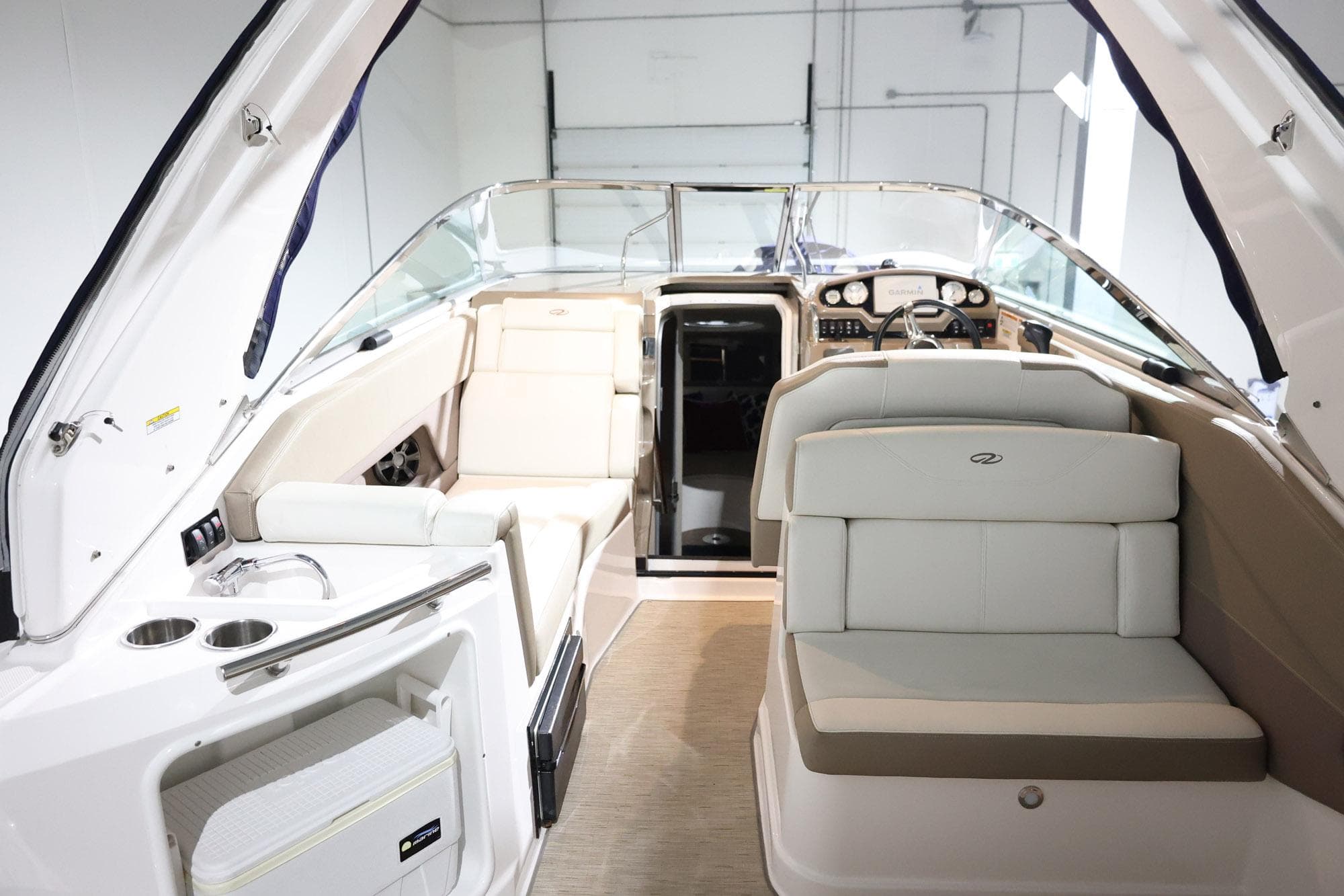 2017 Regal 28 Express boat interior with seating and helm, showcasing modern design.