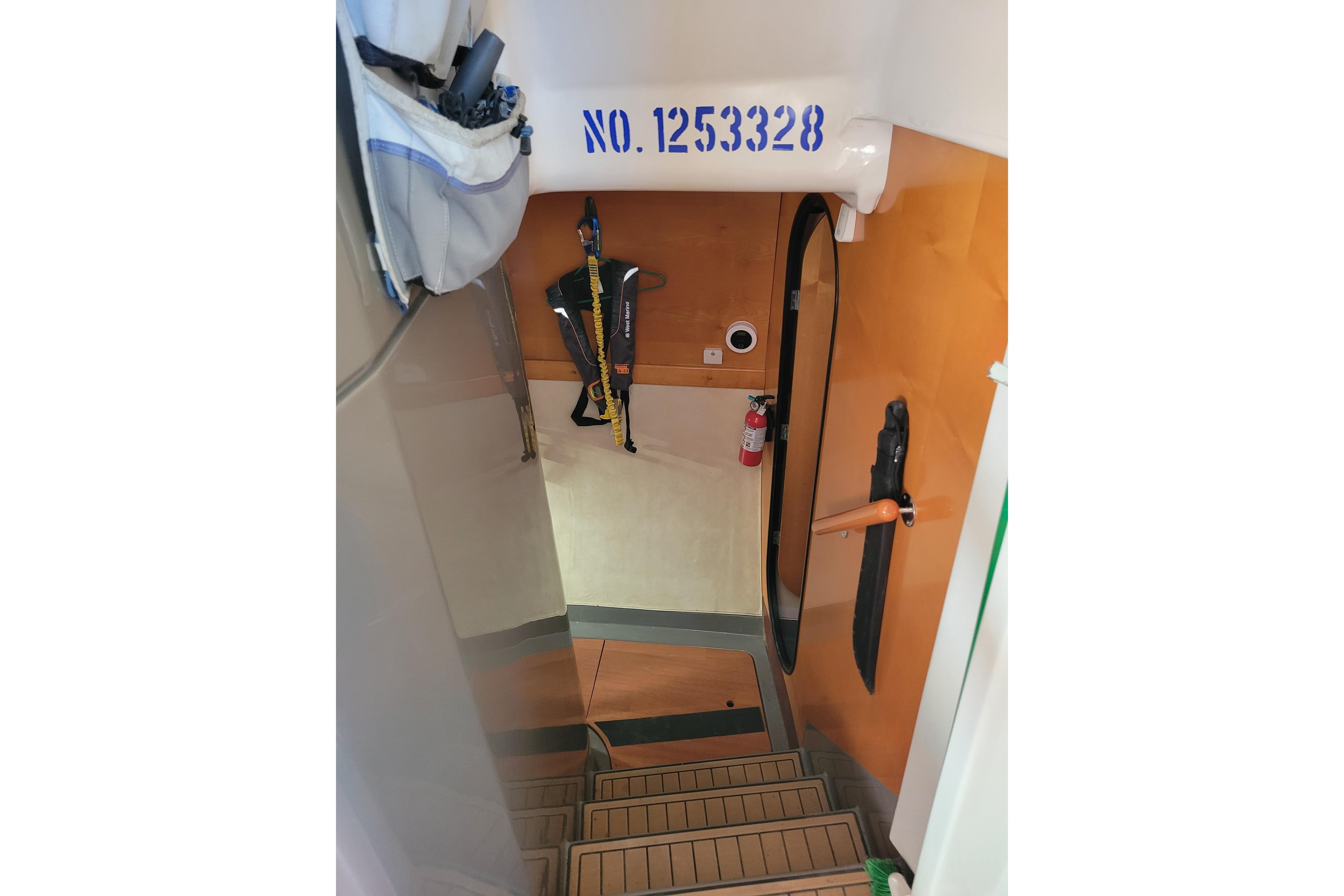 Interior view of 2006 Fountaine Pajot LAVEZZI catamaran with stairs and safety equipment.