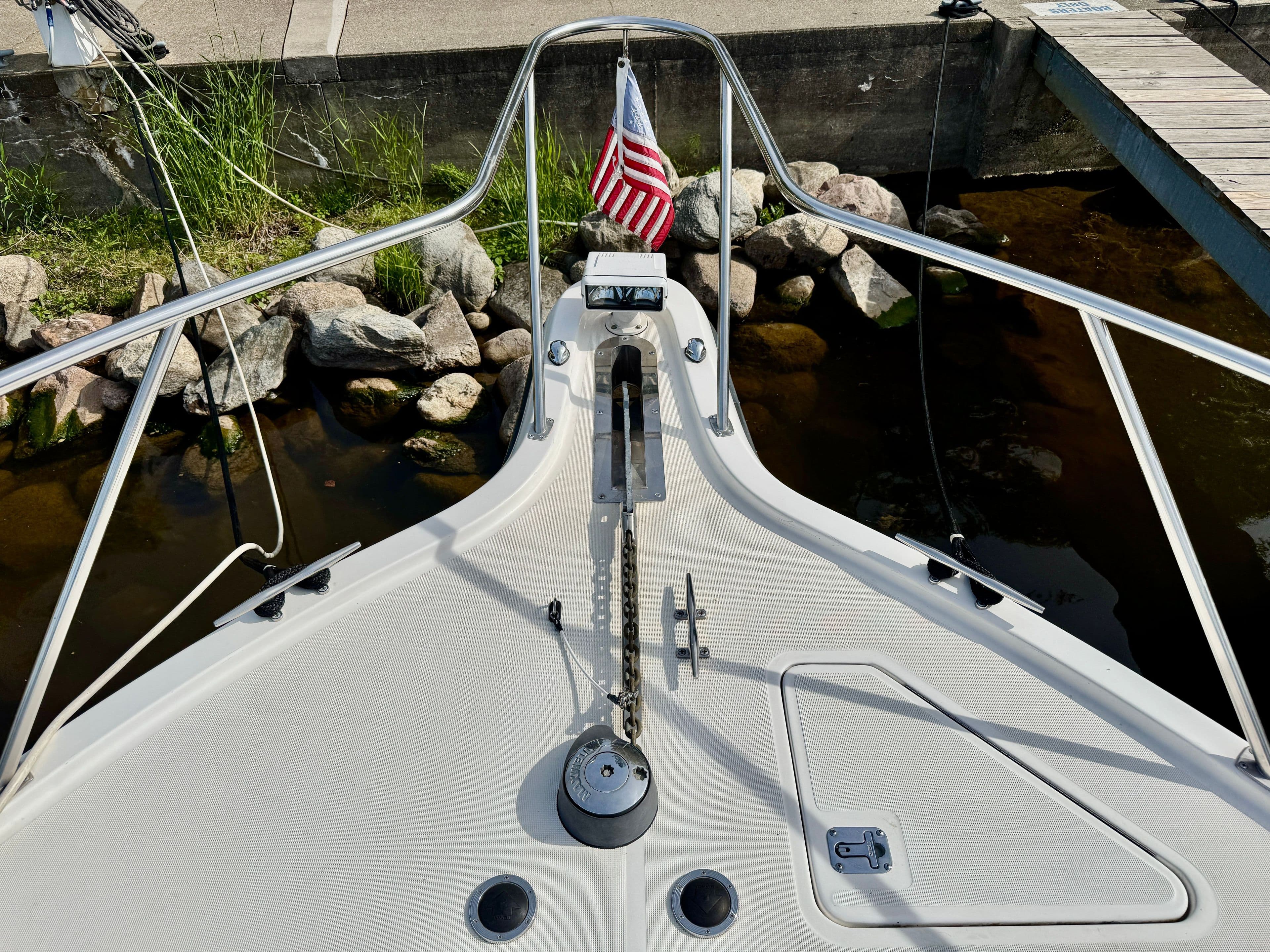 Foredeck of a 1999 Tiara Yachts 4100 Open with flag.