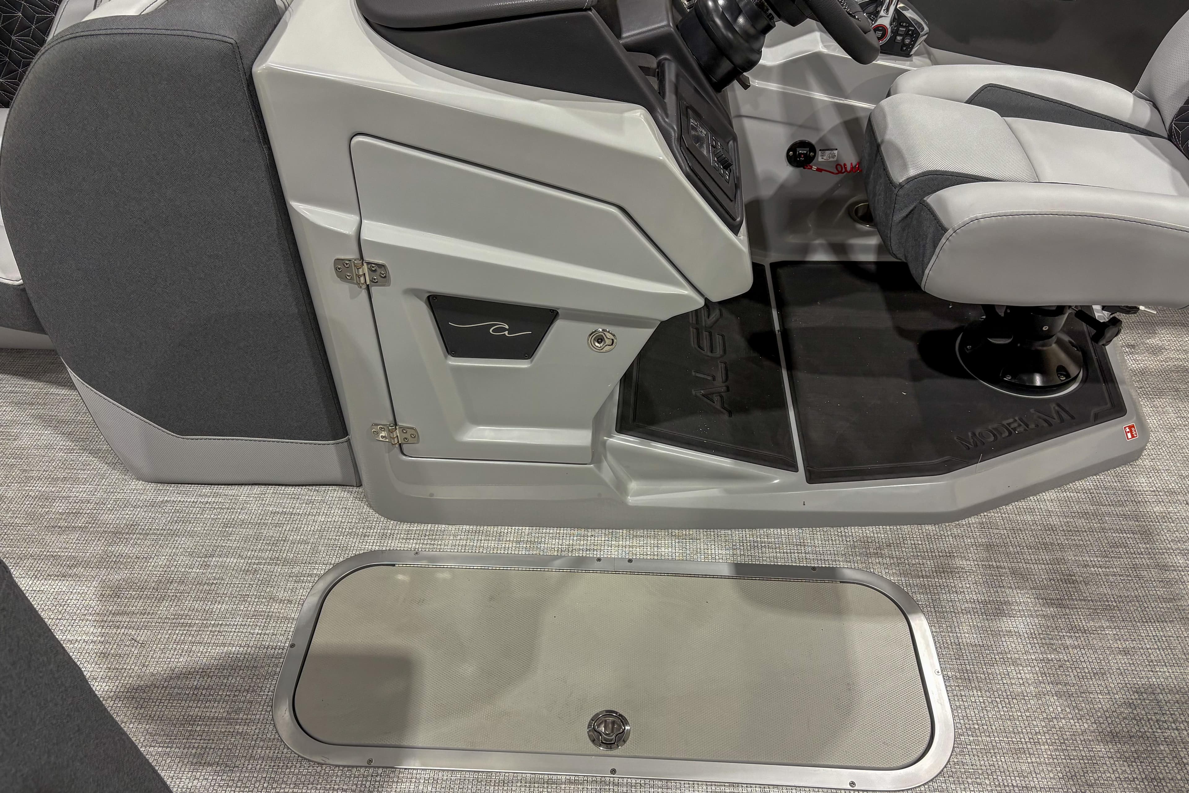 2026 Alera M23L boat interior with gray seating and control panel.