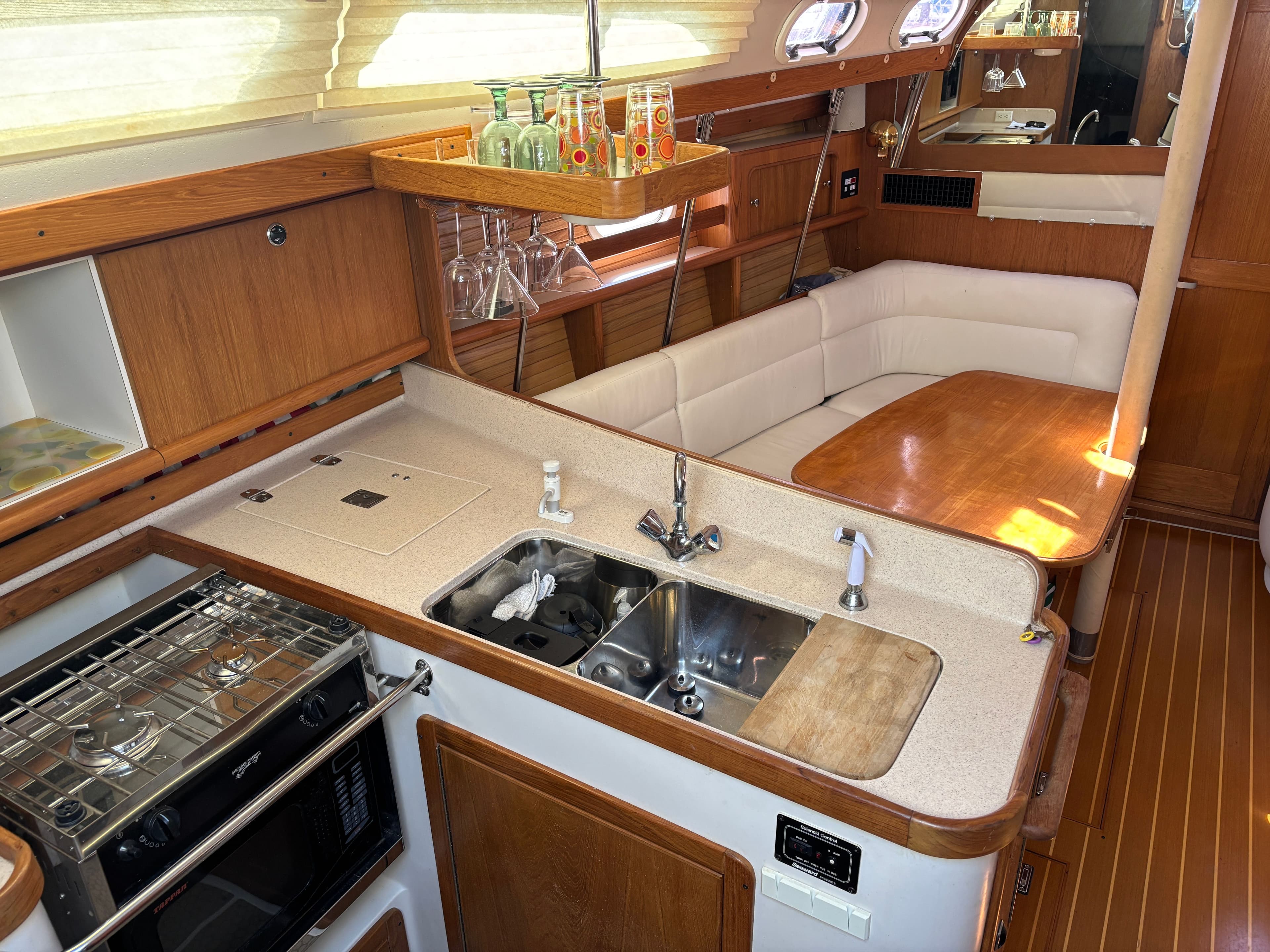 Interior of 2000 Catalina 380 yacht with kitchen and dining area.