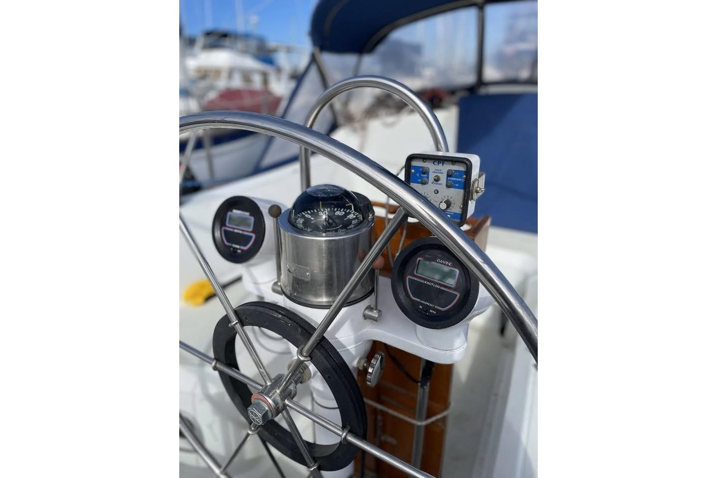 Steering wheel and navigation instruments on 1986 Ericson 381 sailboat.