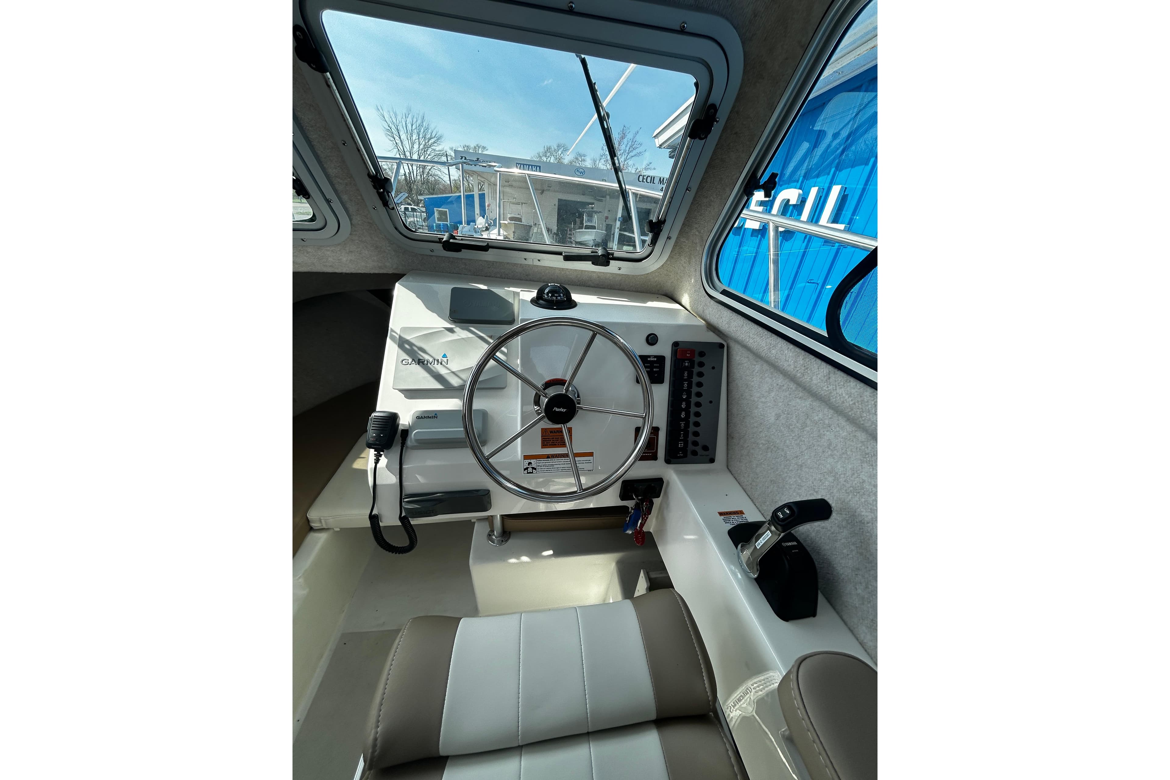 2019 Parker 2320 Sport Cabin interior with steering wheel and control panel.