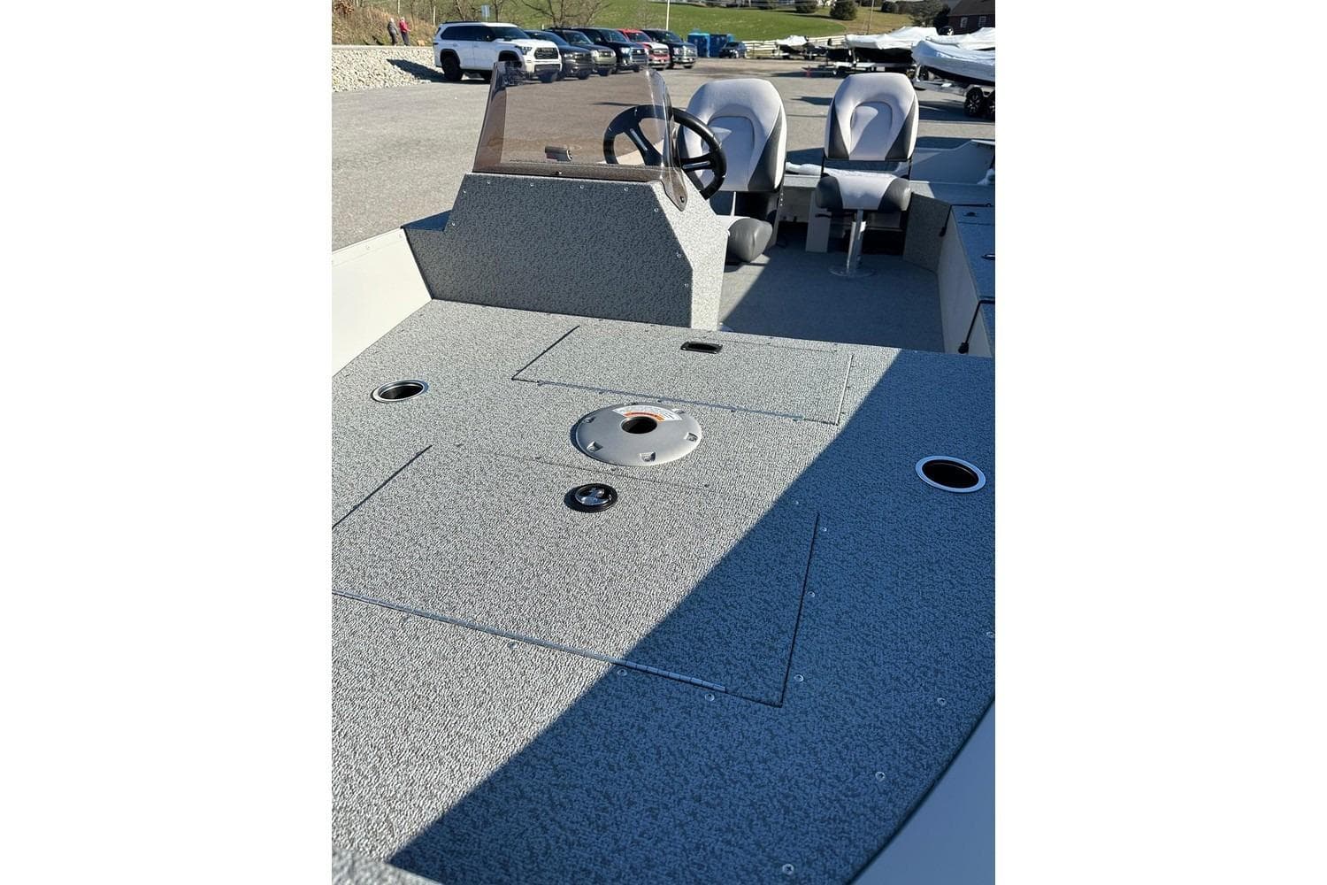 2026 Smoker Craft Angler 16 SC boat interior with steering wheel and seating.