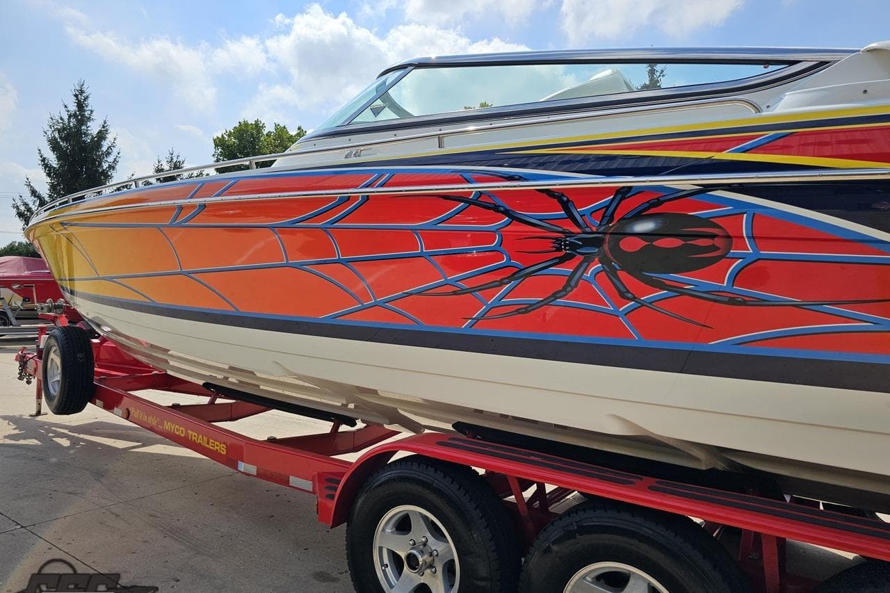 2007 Formula 353 FASTech boat with vibrant spider-themed graphics on a red trailer.