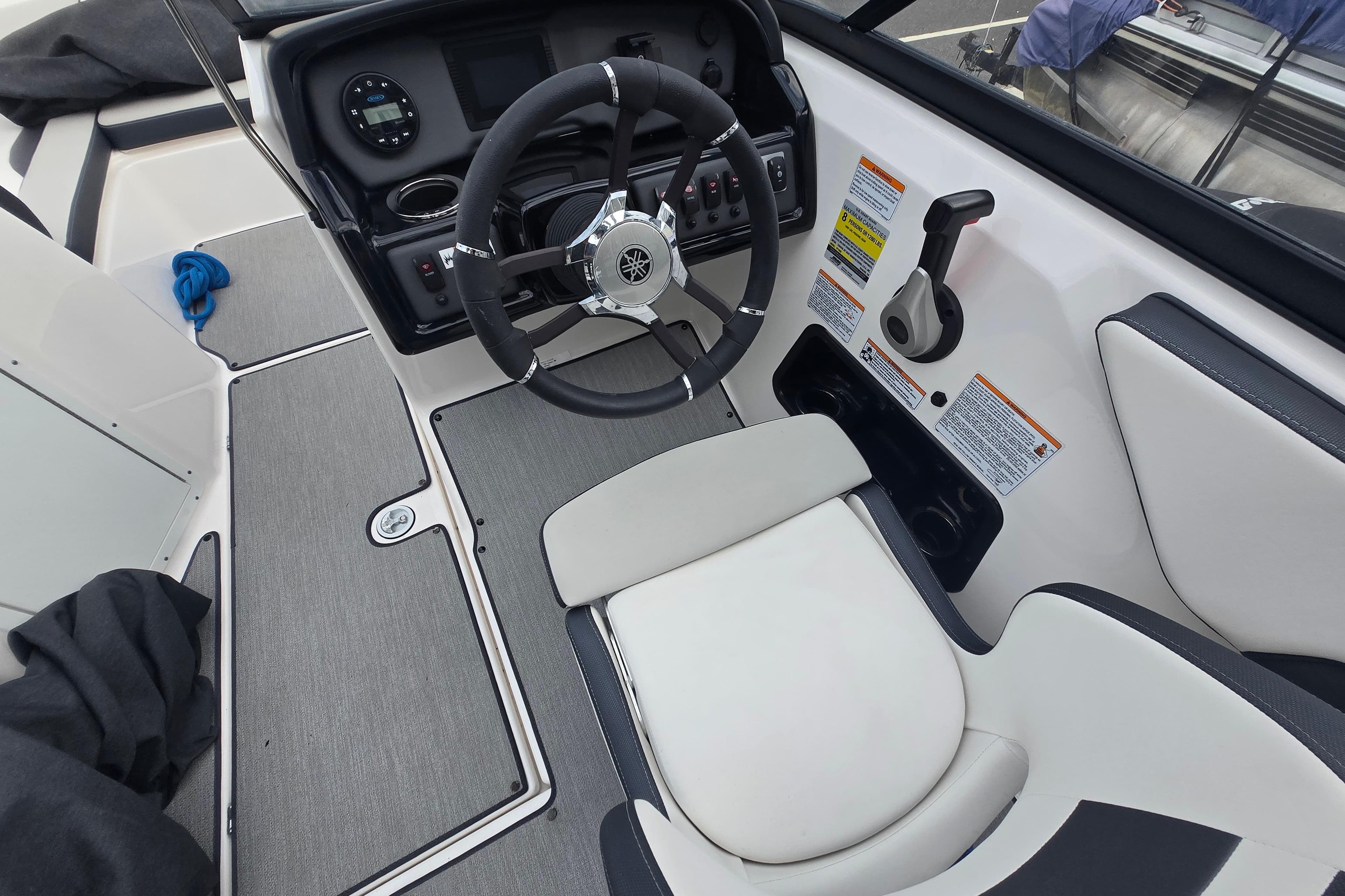 2021 Yamaha Boats AR195 cockpit with steering wheel and control panel.