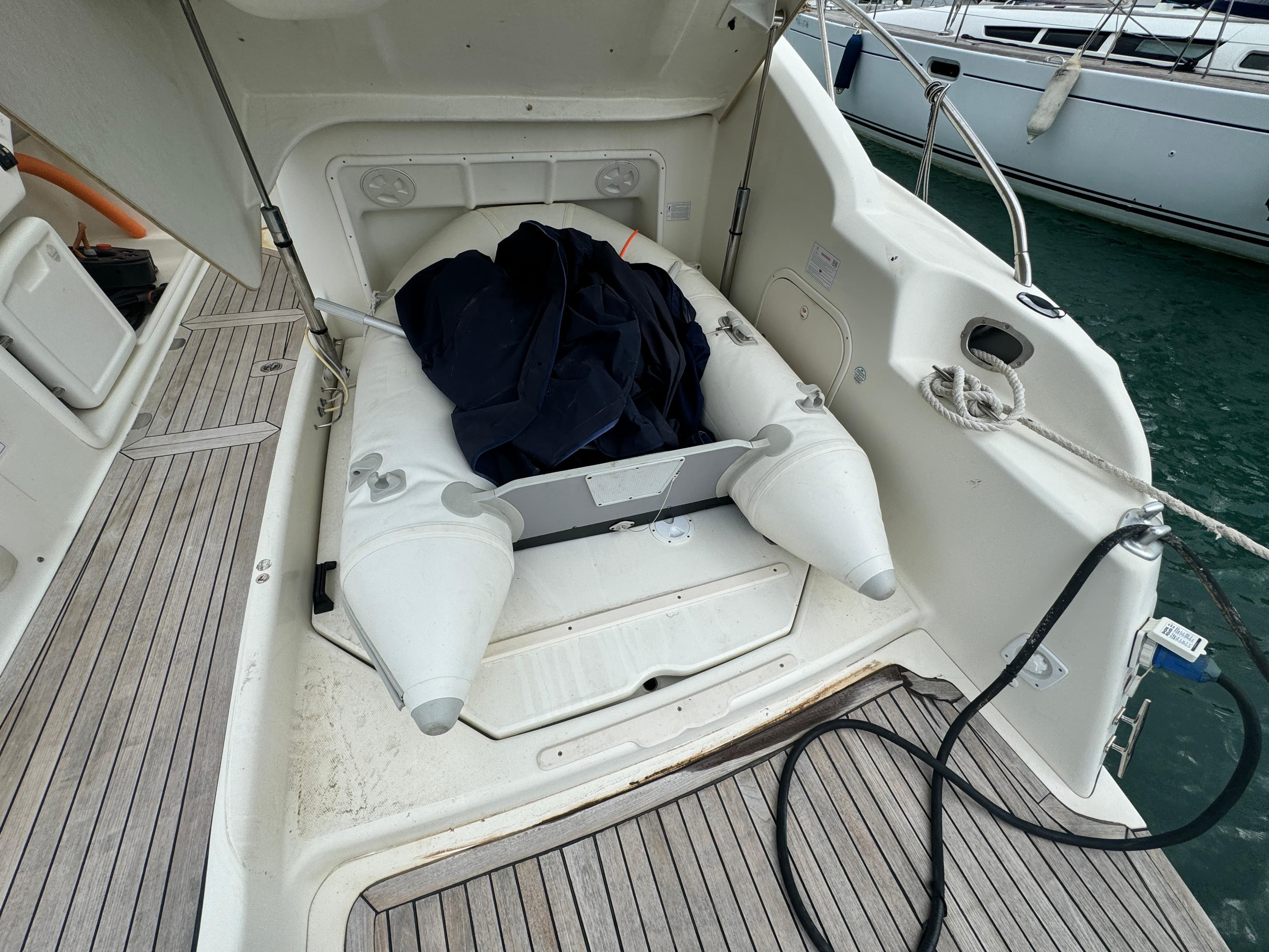 2008 Cranchi Endurance 41 yacht with inflatable dinghy on deck.