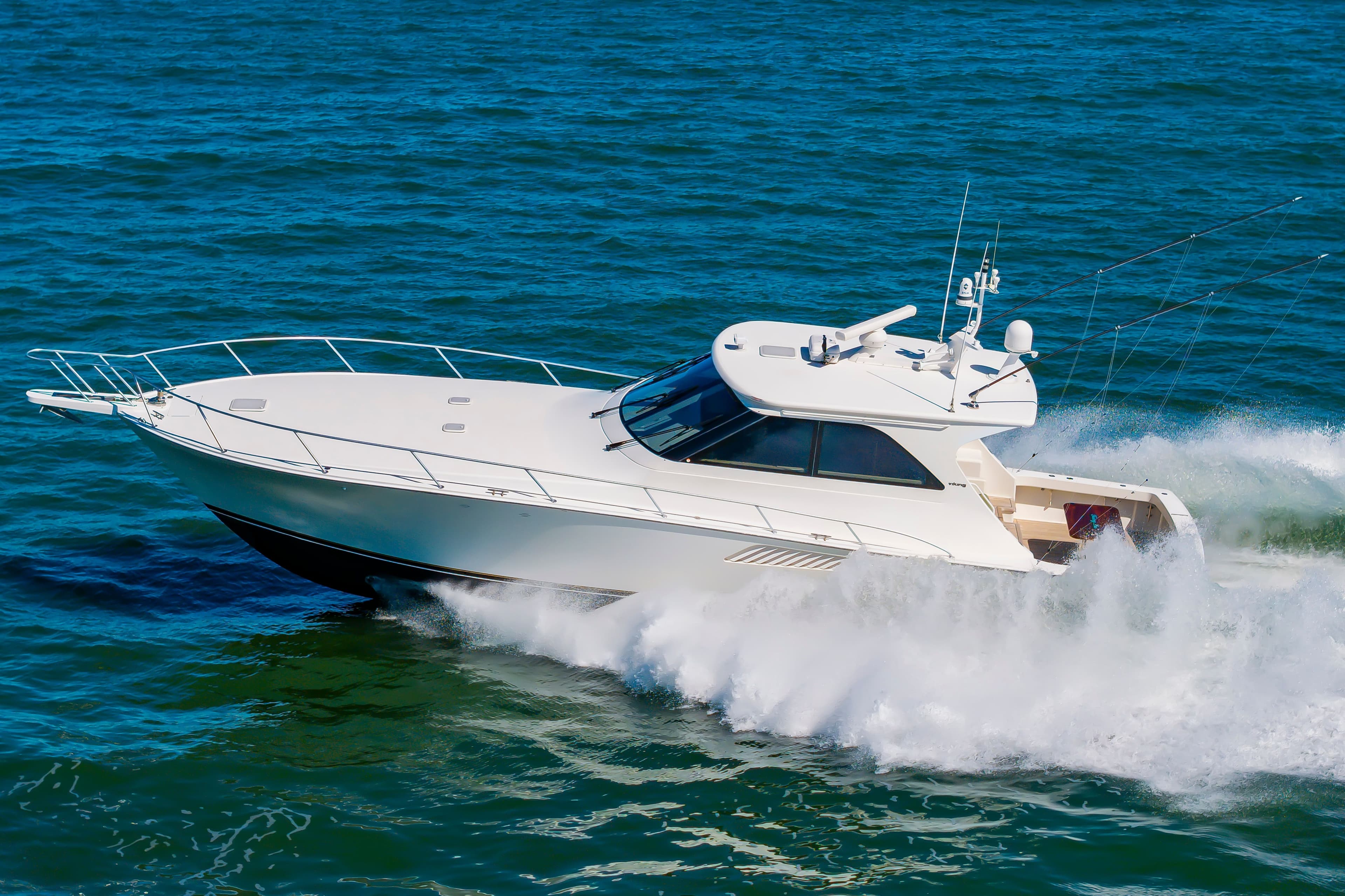 2010 Viking 52 Sport Coupe Yacht cruising on open sea.