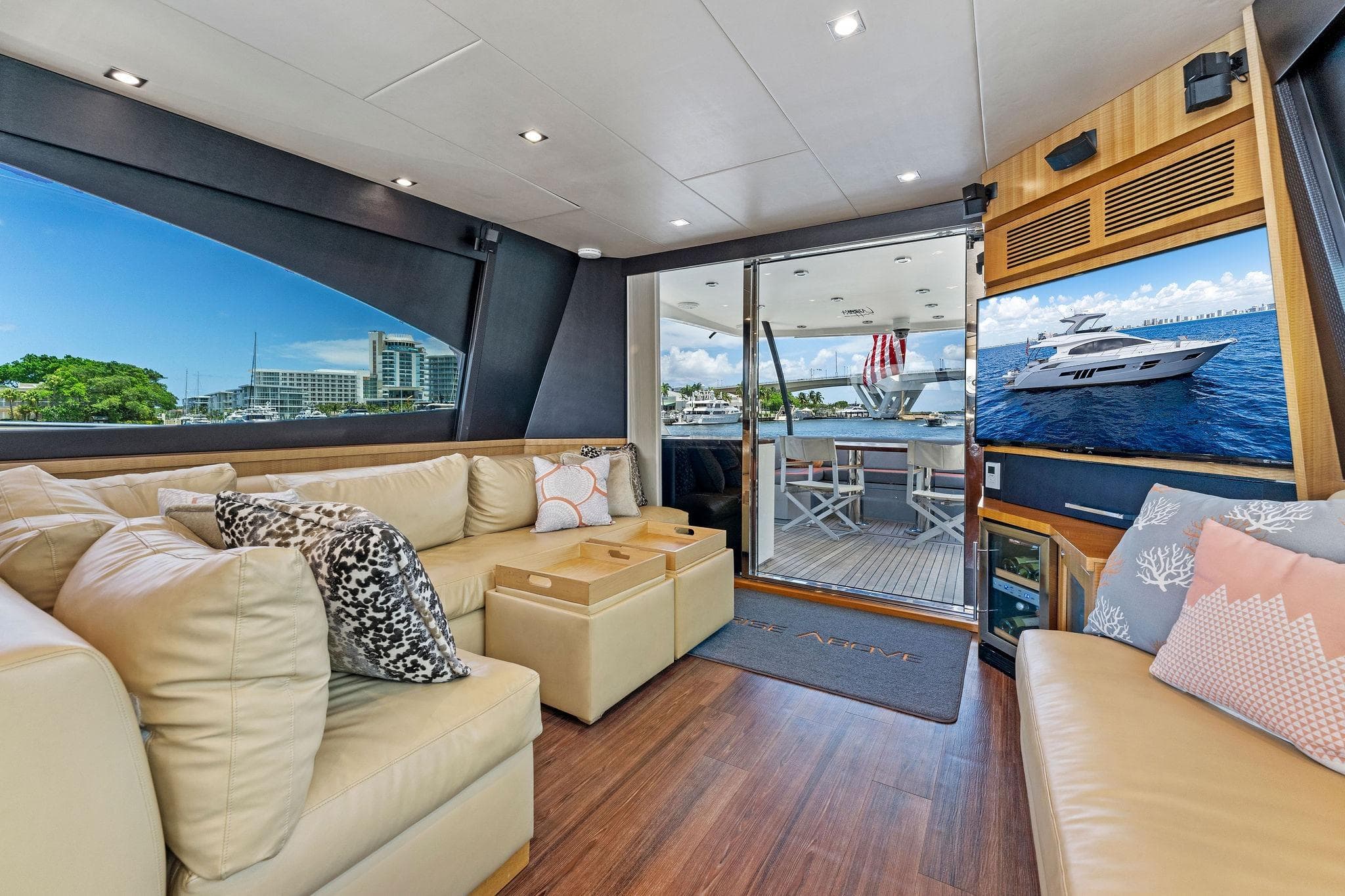 Luxurious interior of 2014 Lazzara 64 yacht with plush seating and scenic views.