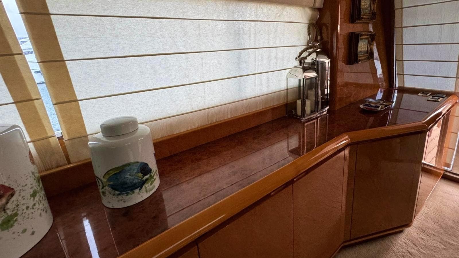Luxurious interior of a 1993 Diano 22 yacht with elegant wooden cabinetry.