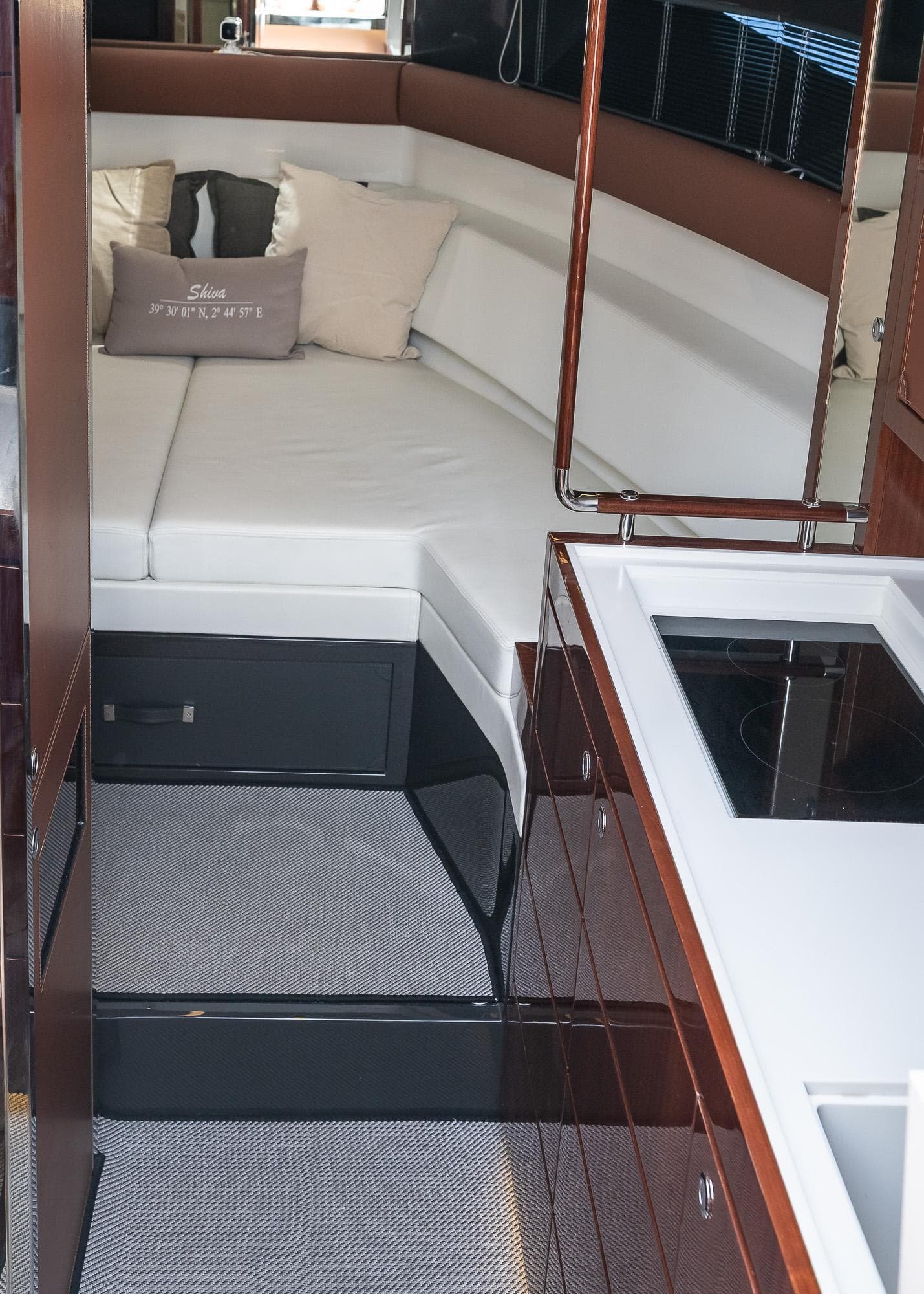 2022 Riva Rivamare yacht interior with modern kitchen and cozy seating area.