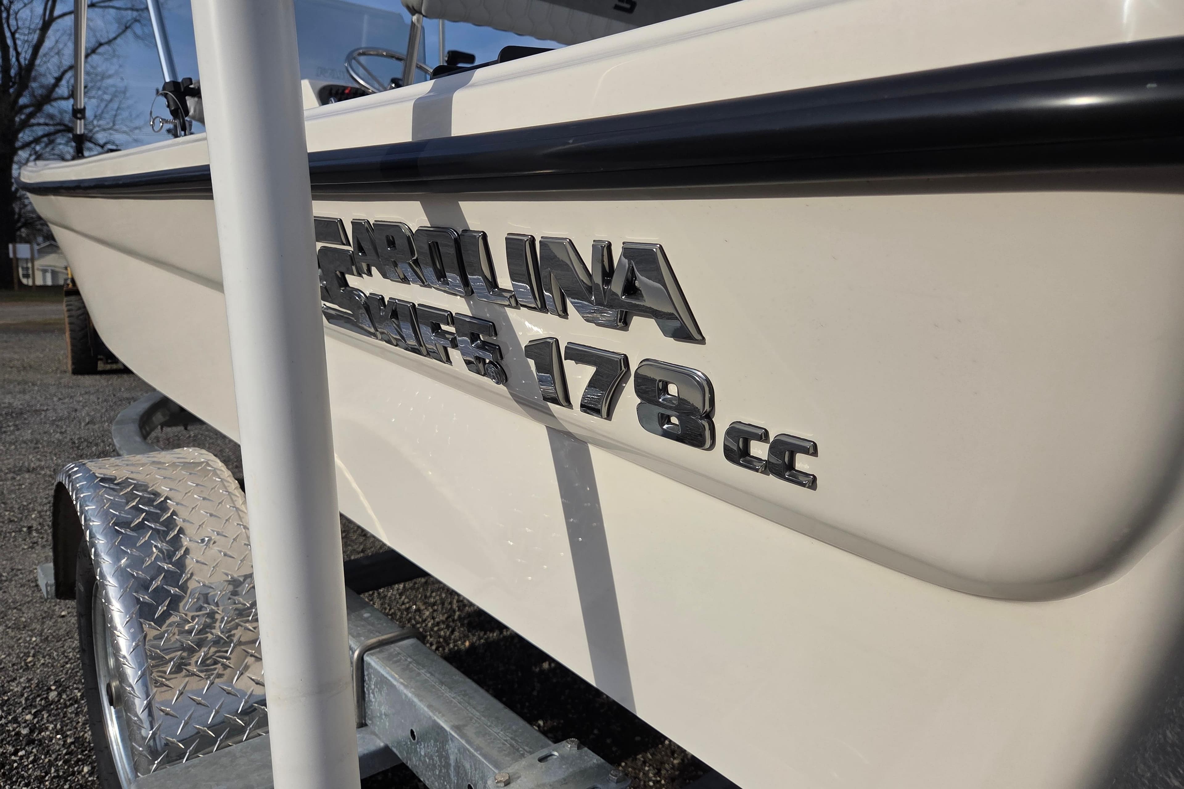 2026 Carolina Skiff 178 JLS boat on trailer, close-up of logo and hull.