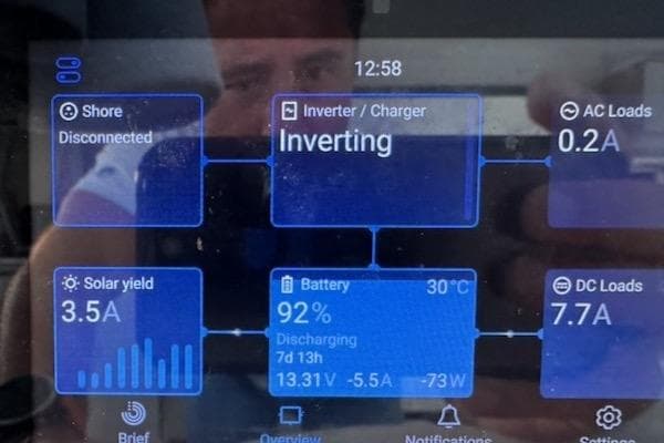 Touchscreen display showing solar yield, battery status, and inverter details on Excess 14, 2025 model.