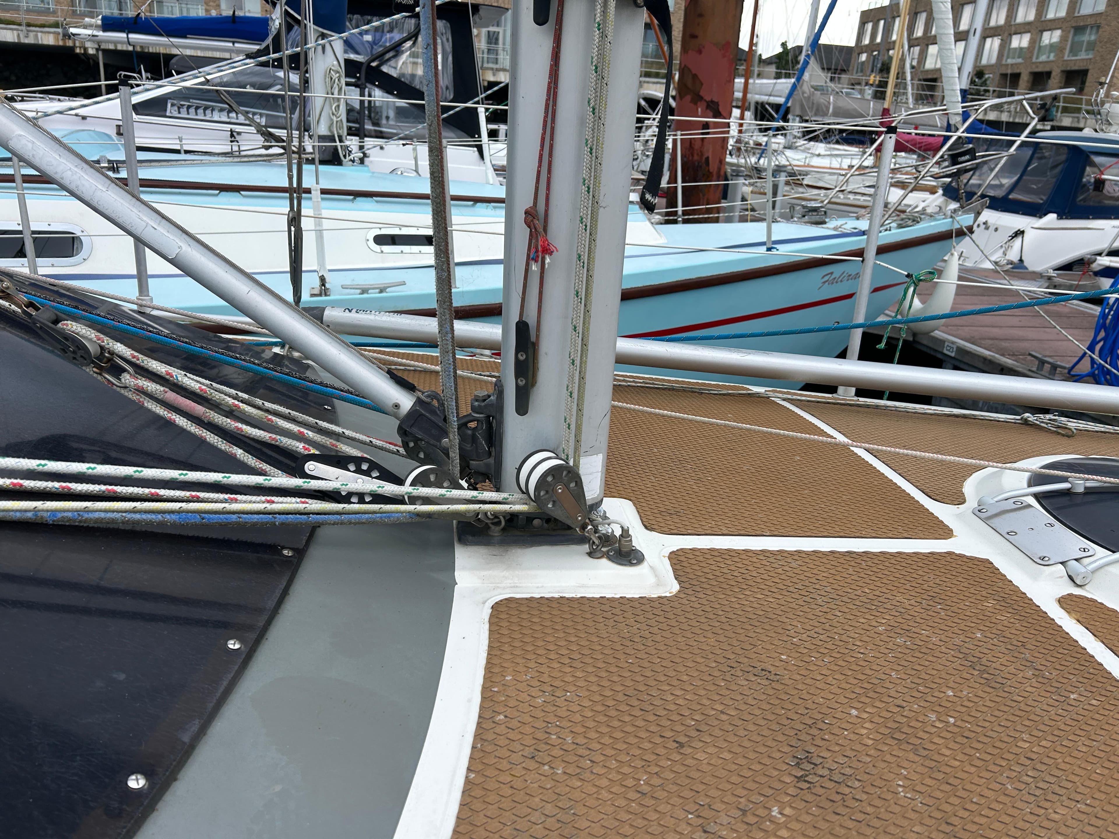 1991 Etap 28i sailboat deck with rigging in a marina setting.