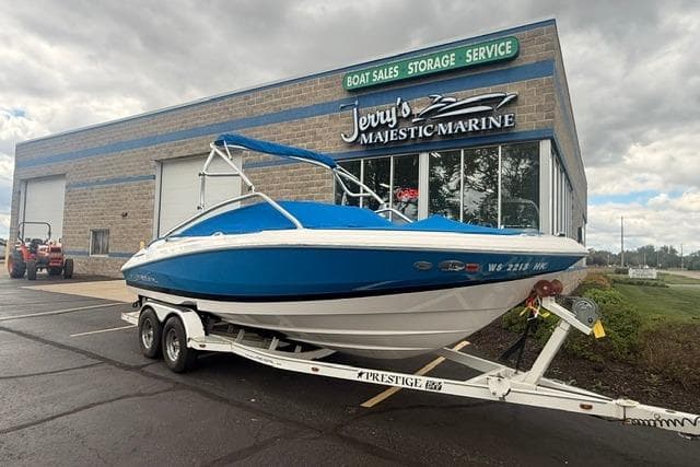 Blue 2007 Regal 2200 Bowrider boat on trailer outside Jerry's Majestic Marine.