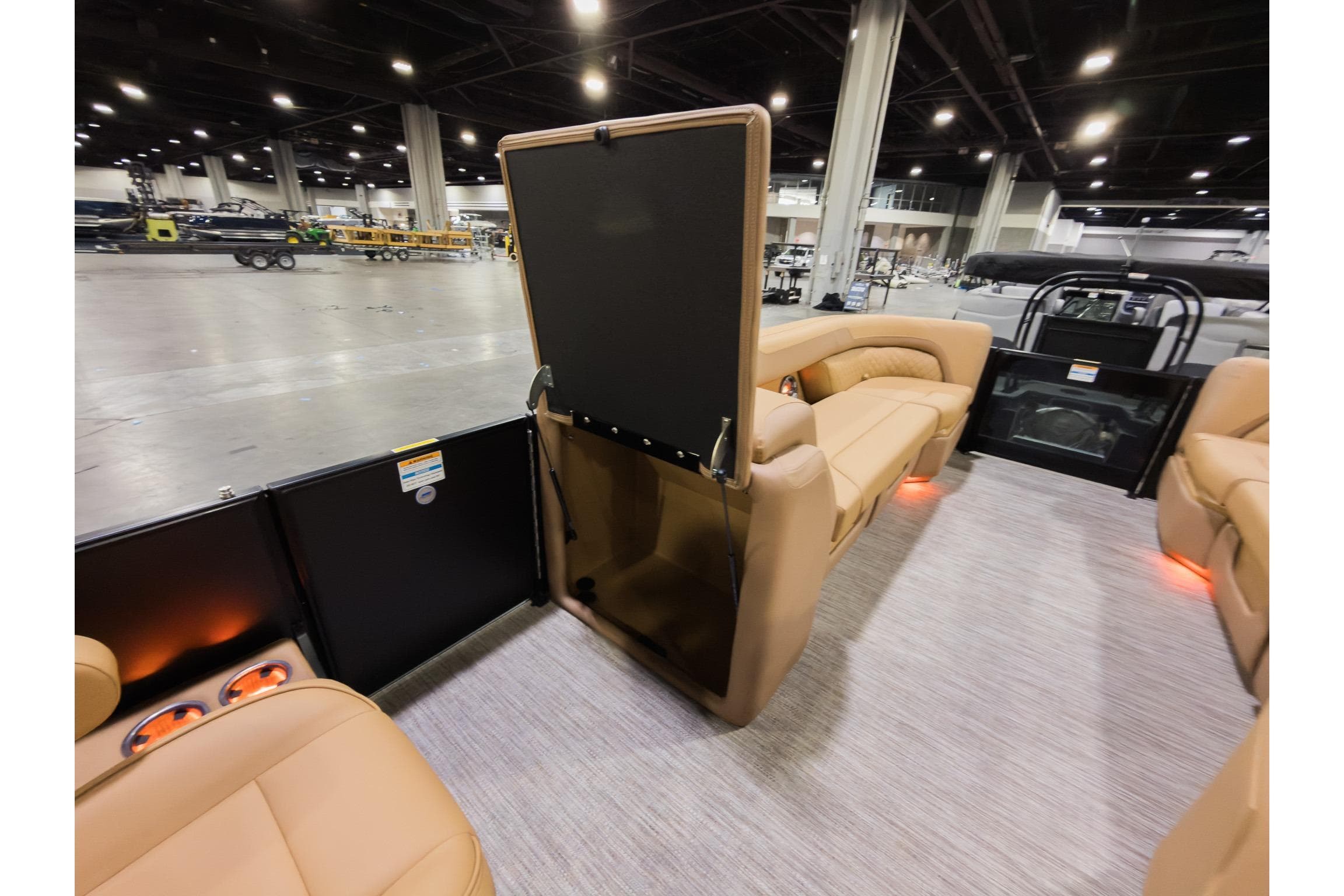 2026 Godfrey Sweetwater 22' Tritoon interior with tan seating and modern design.