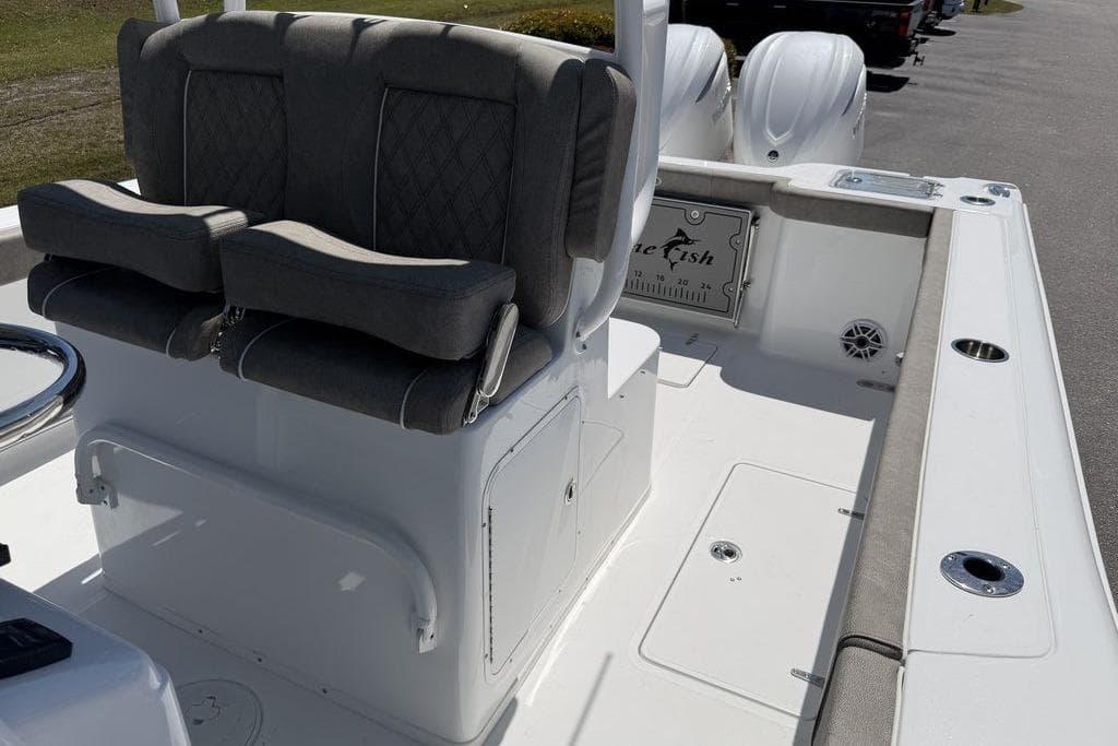 2026 Sea Hunt Gamefish 30 Forward Seating boat interior with cushioned seats and storage.