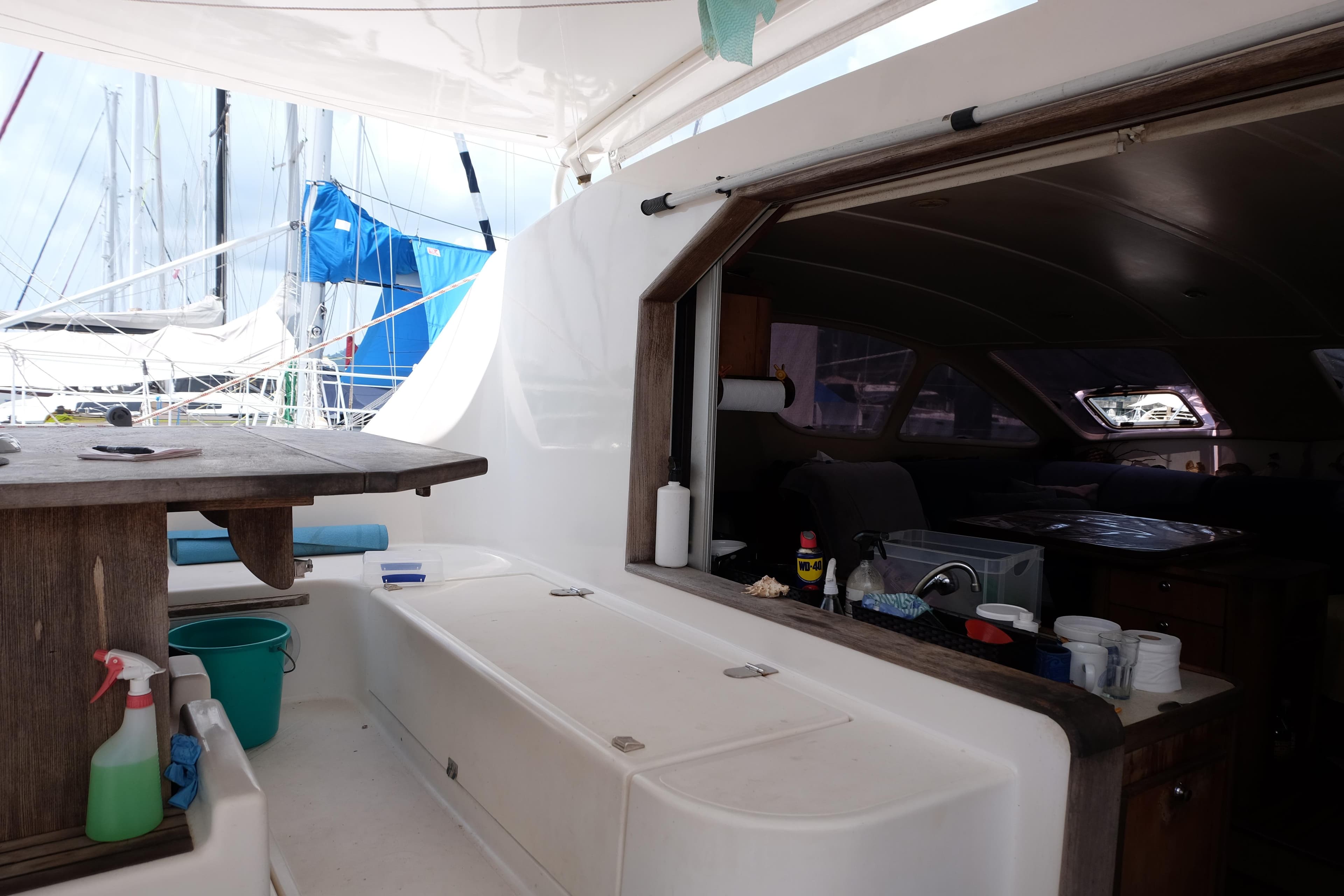 Catana 471 yacht interior, 2002 model, featuring a cozy kitchen and dining area.