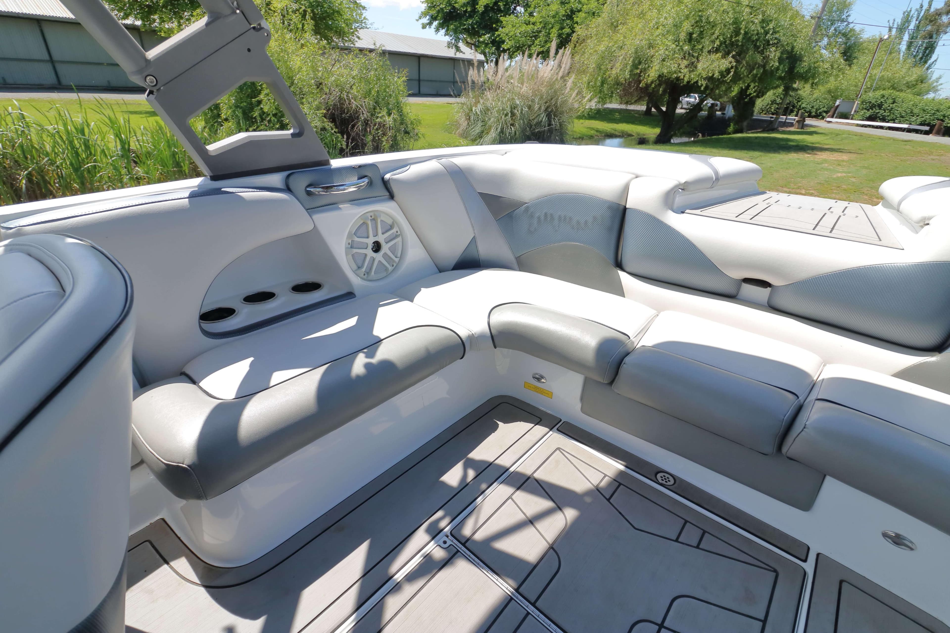 Interior of a 2018 Sanger 212 SL boat with gray and white seating.