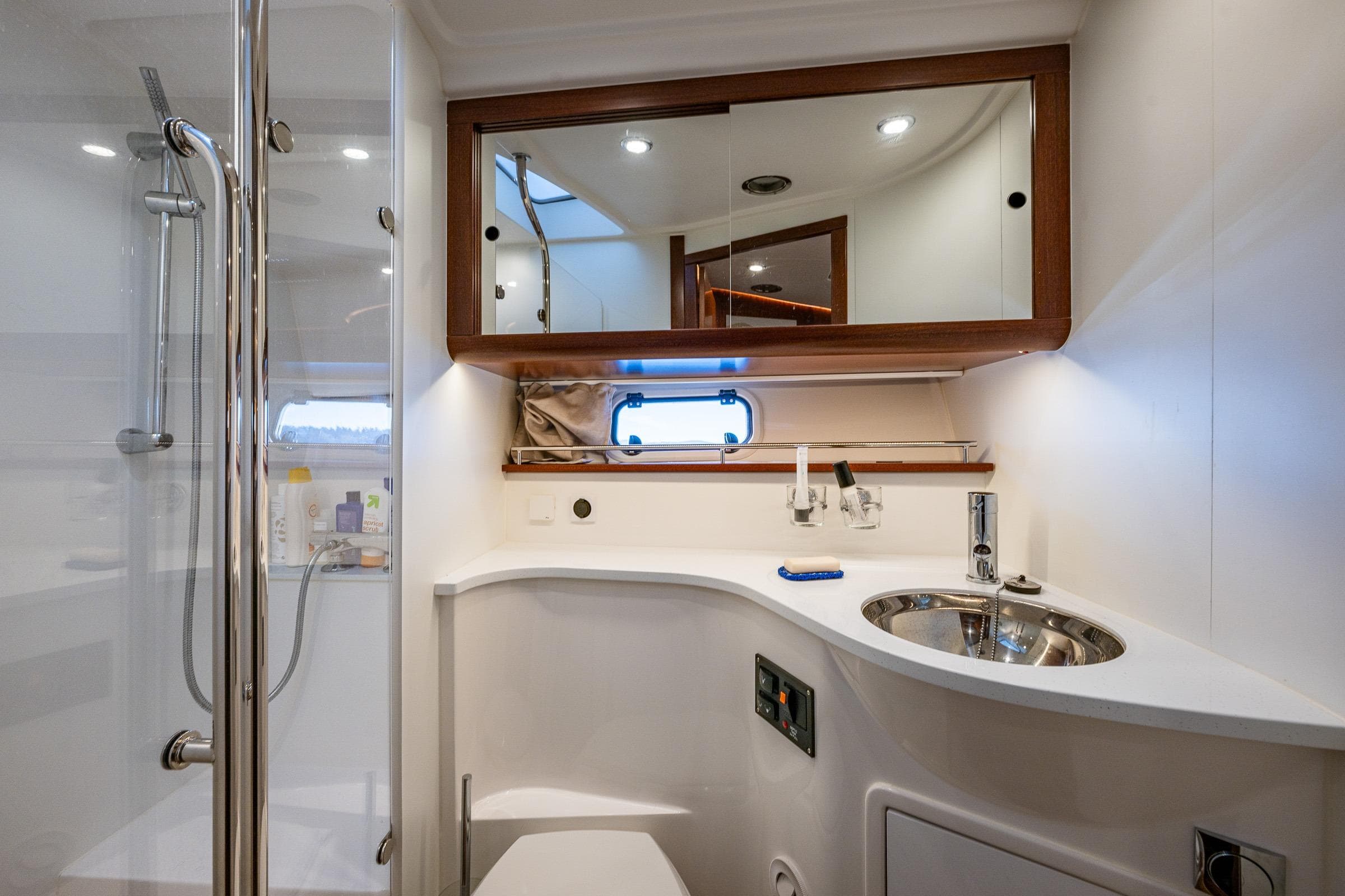Luxurious bathroom in 2023 Nimbus 405 Flybridge yacht with modern fixtures and elegant design.