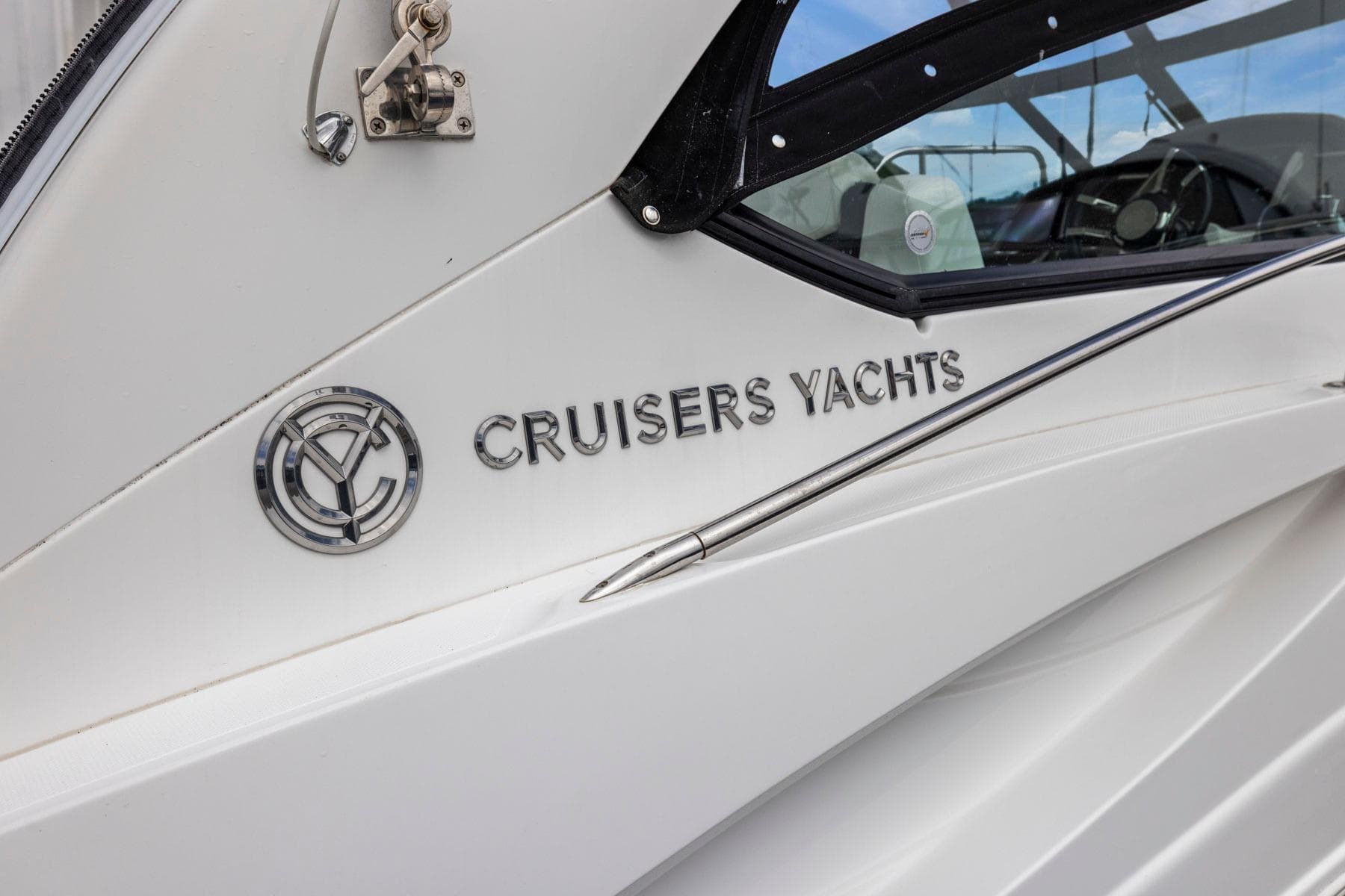 2019 Cruisers Yachts 38 Express logo on white yacht exterior.