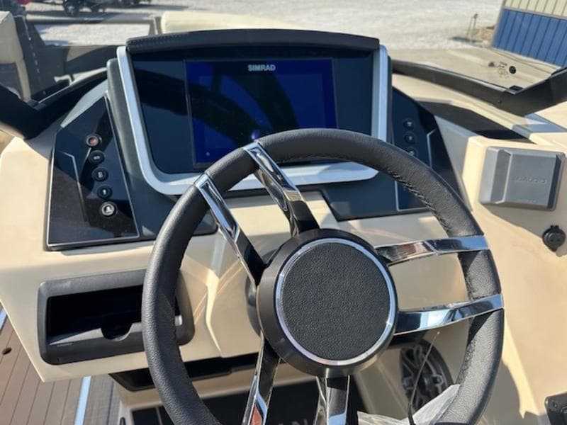 Steering wheel and dashboard of 2025 Sylvan G-3 CLZ DC boat.
